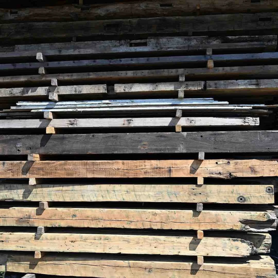 Thumbnail of stacked antique reclaimed industrial timbers with aged patina, saw marks, and varying dimensions.