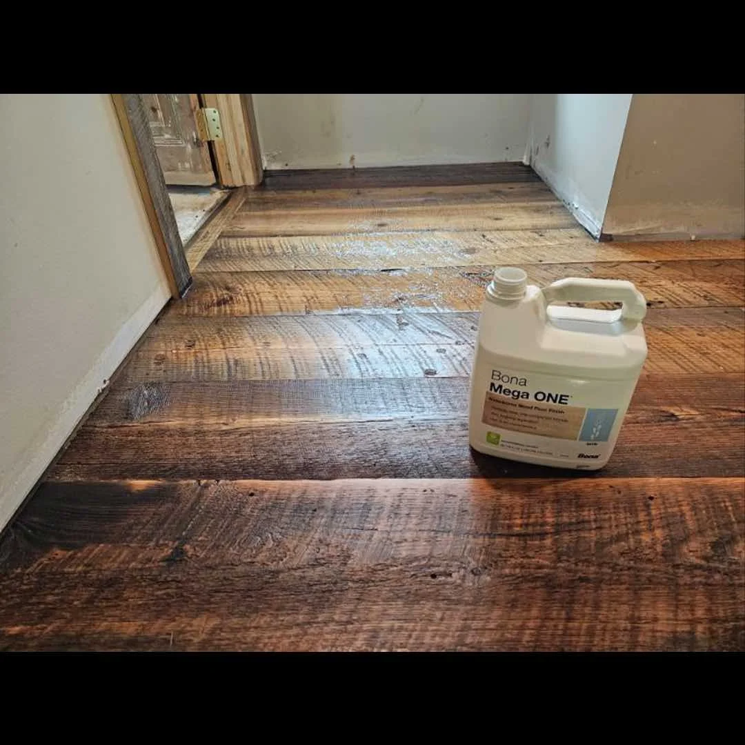 Thumbnail of antique reclaimed dirty top flooring with saw marks and natural patina installed in a client's home.
