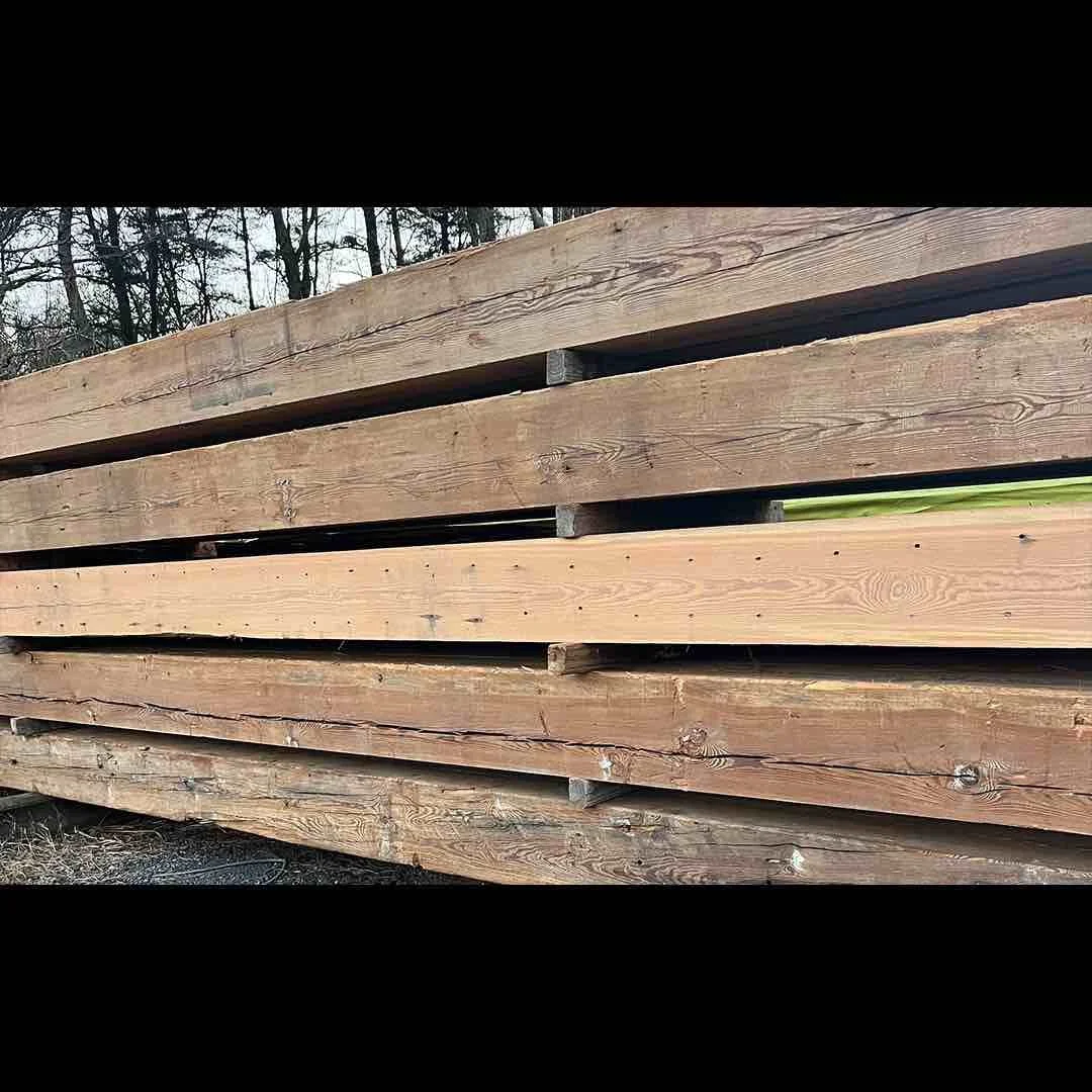 Thumbnail of stacked antique reclaimed  industrial timbers with visible grain lines, natural weathering, and aged patina.