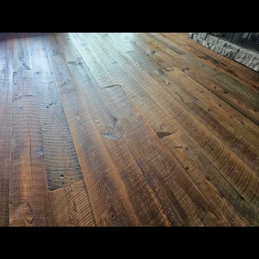 Thumbnail of antique reclaimed longleaf pine flooring with visible saw marks, showing rich patina, textured grain, and character from its historic industrial origin.