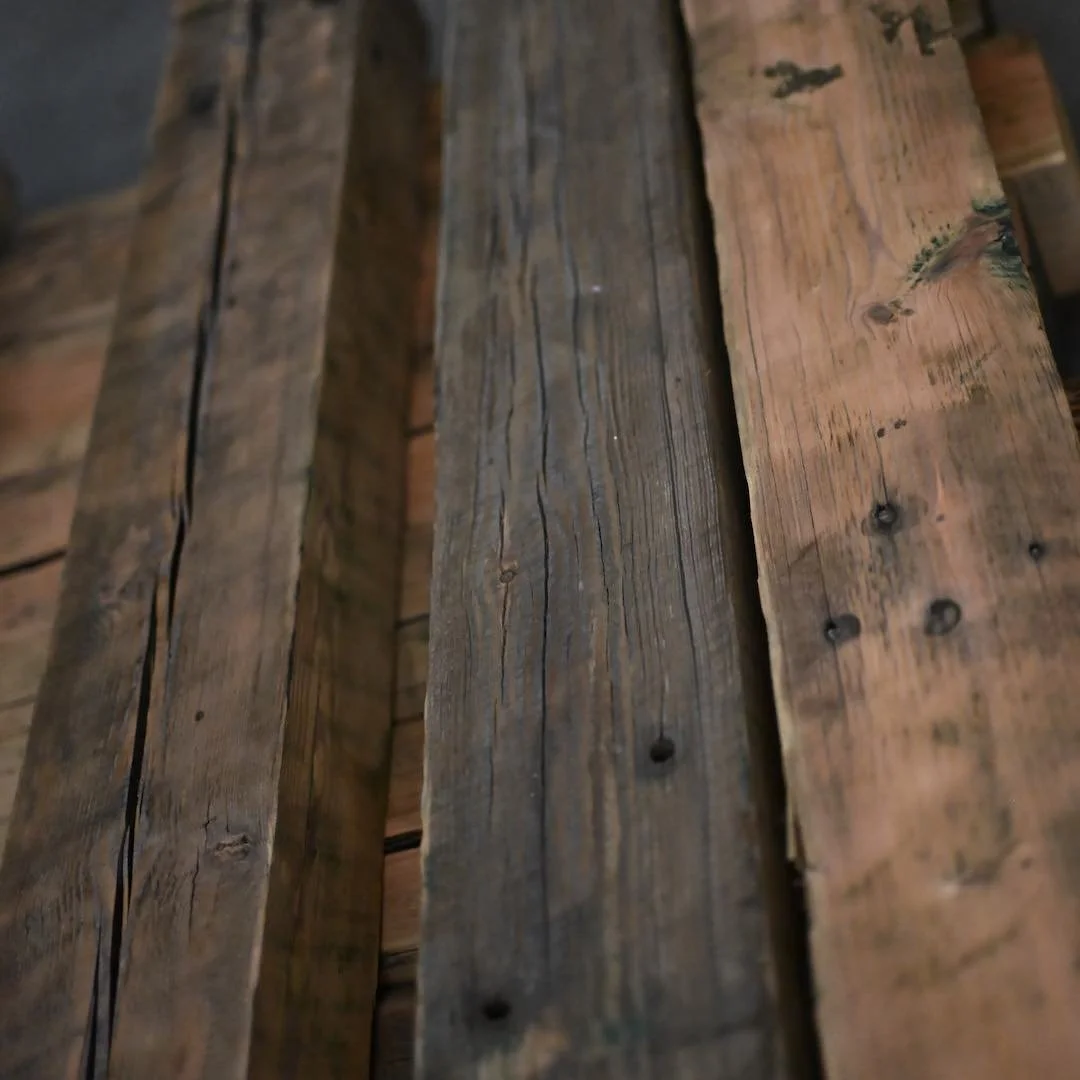 Thumbnail of antique reclaimed beam mantels stacked on pallet, featuring, natural crack, aged character, and natural patina.