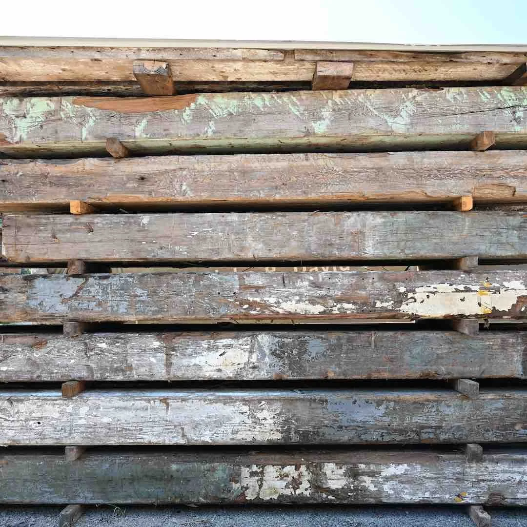 Thumbnail of stacked antique reclaimed industrial timbers with aged paint, weathered patina, and rustic texture.
