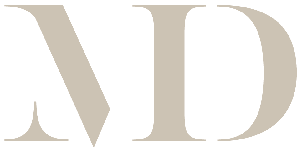 Close-up of the large, stylized letters 'WD' in beige color on a black background.