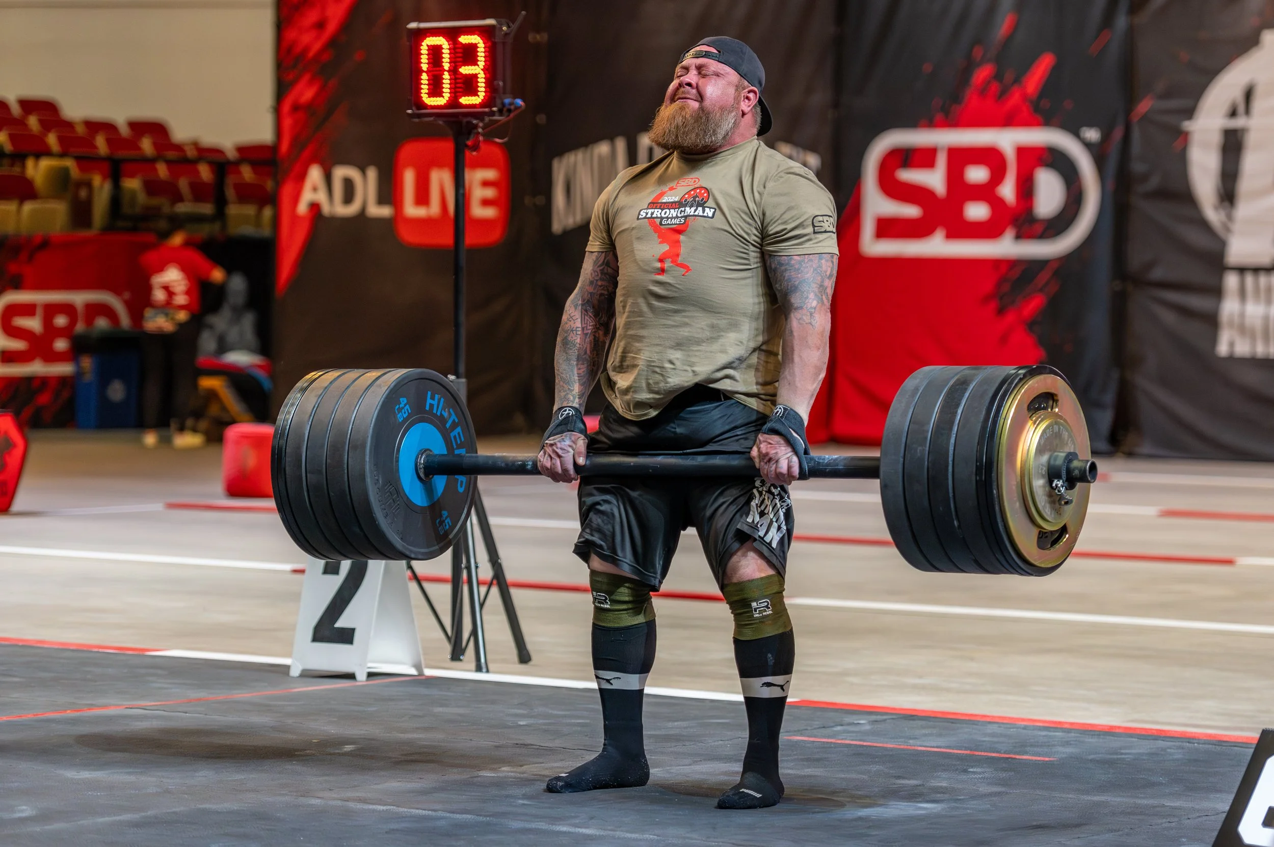 US Army veteran Doug Madewell competes in the deadlift event at the Official Strongman Games, a strongman competition. OSG. Veteran strongman athlete. Photo by John Krzesinski.