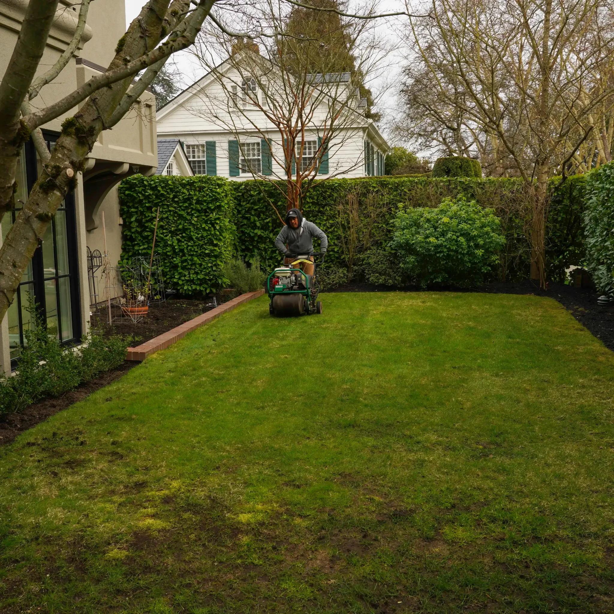 Lawn core aeration and turf conditioning for smooth, healthy grass in premium residential landscapes.