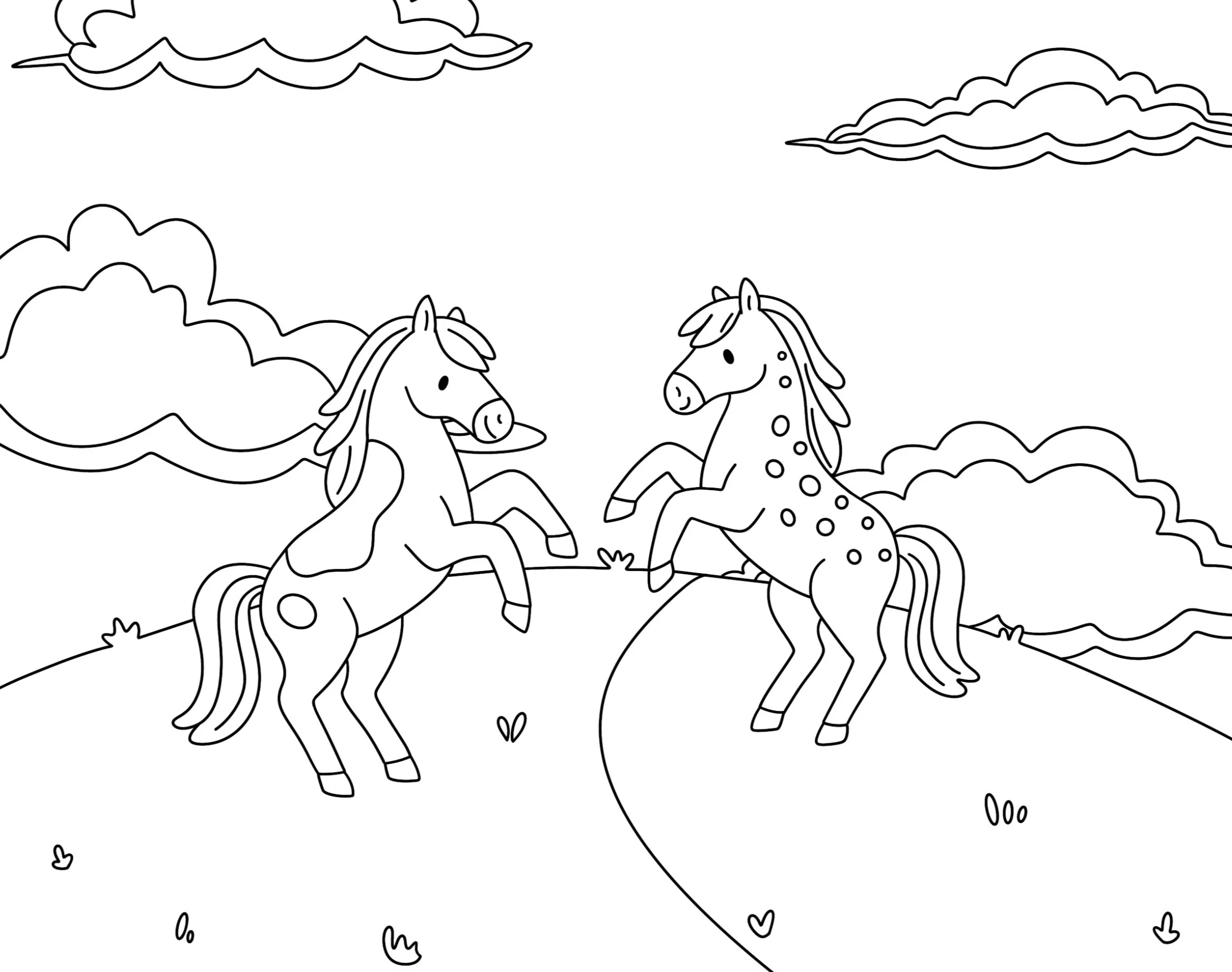Black and white coloring page of two horses rearing on a hill, with clouds in the sky and small plants on the ground.