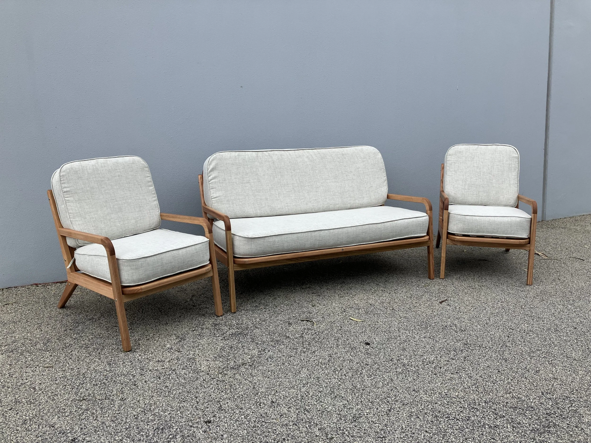 Custom lounge in oak cushions covered in Warrick fabric