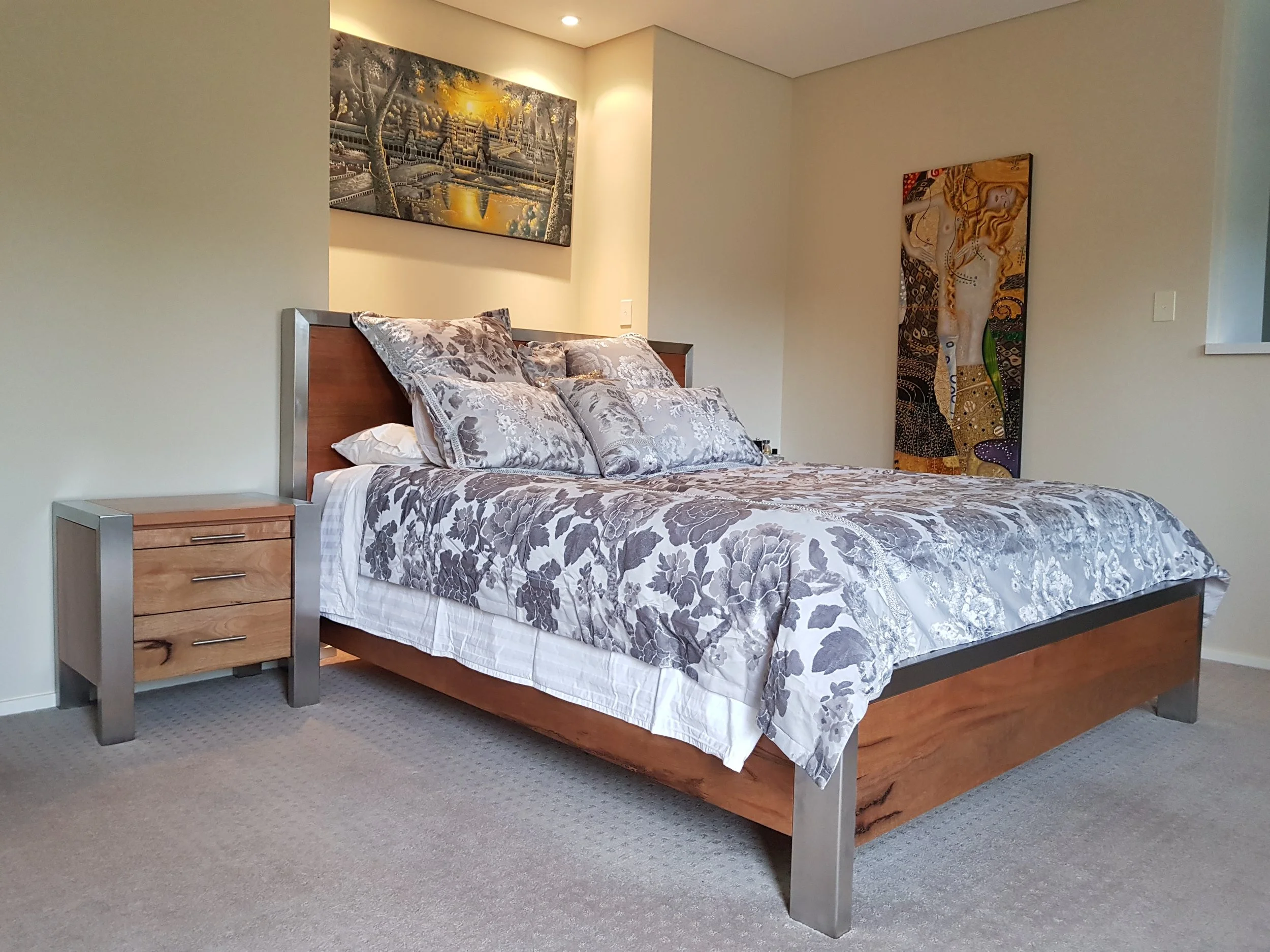 Marri and stainless steel king size bed