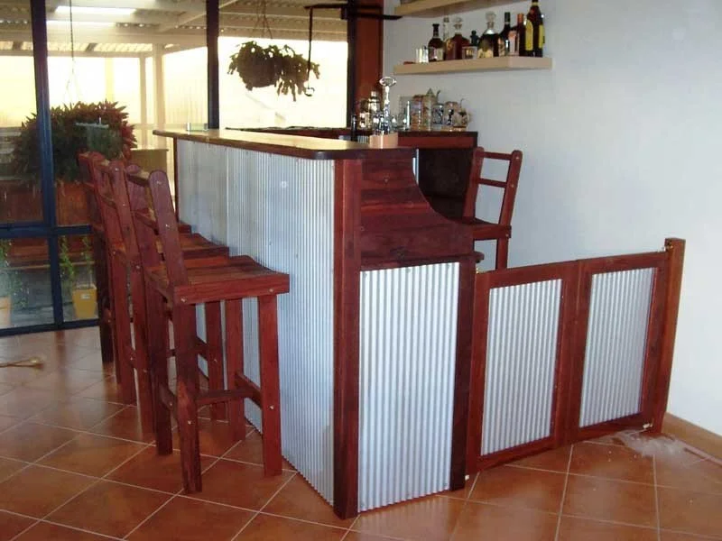 Quintessential Jarrah and corrigated iron bar. This bar was fitted with saloon style doors, a wine rack, and space for an undercounter bar fridge.