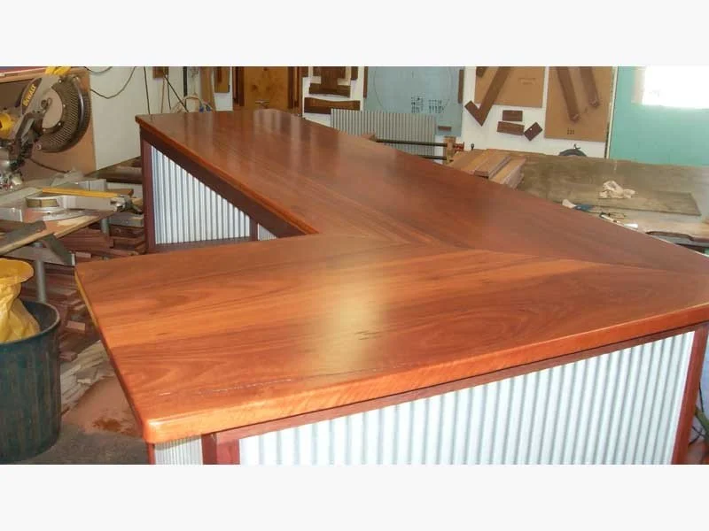 L shaped Jarrah and Mini Orb Bar with space for a fridge and internal shelving.