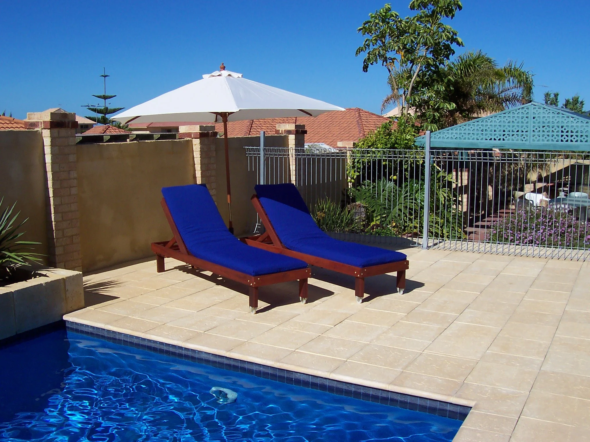 Standard Jarrah sunloungers with Blue cushions