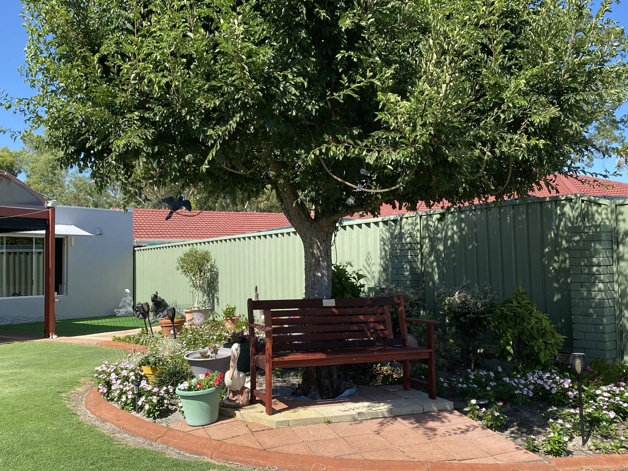 Garden bench with custom back and complimentary memorial plaque