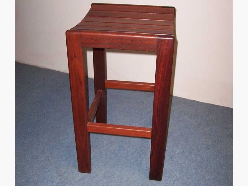 Solid Jarrah bar stool finished with natural tung oil and beeswax to give. This finish is easy to maintain.