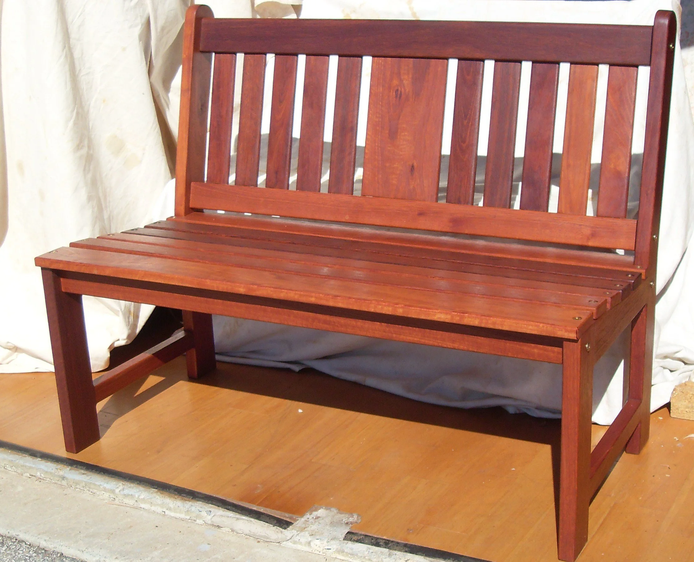 Jarrah Clive's bench without arms, works well with dining height tables