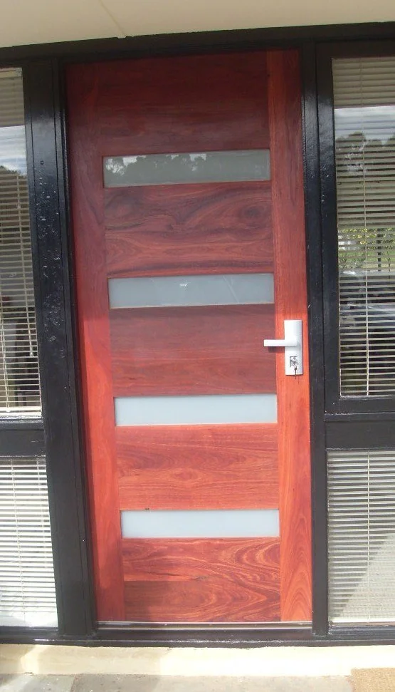 a Full Height custom Jarrah door with frosted glass inserts
