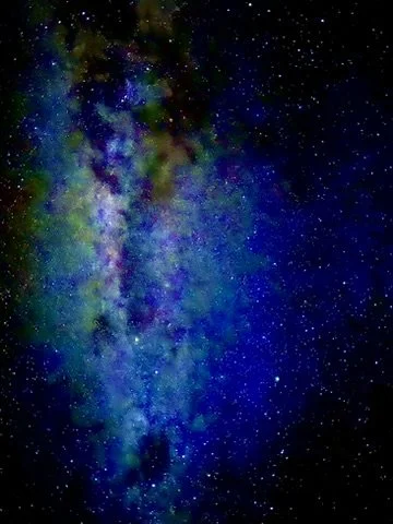 Colorful view of the Milky Way galaxy with stars and cosmic dust in a dark night sky