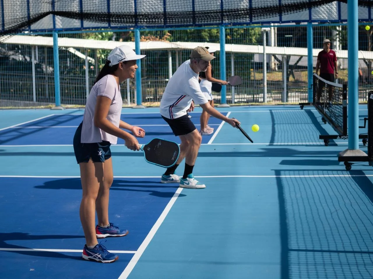 Students dinking in our pickleball introduction session for beginners Singapore