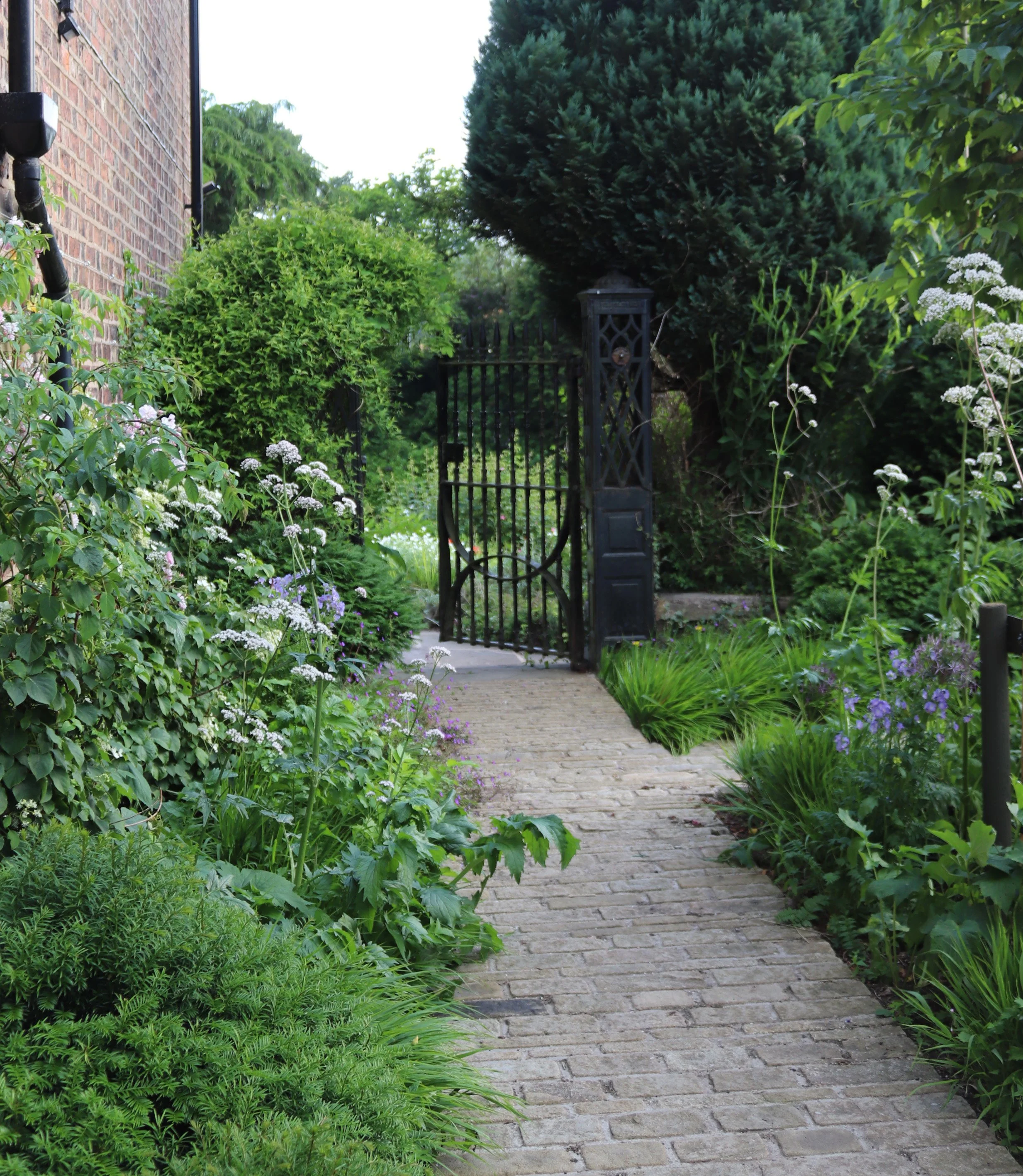 Sloping gardens to a Georgian house in the Peak District