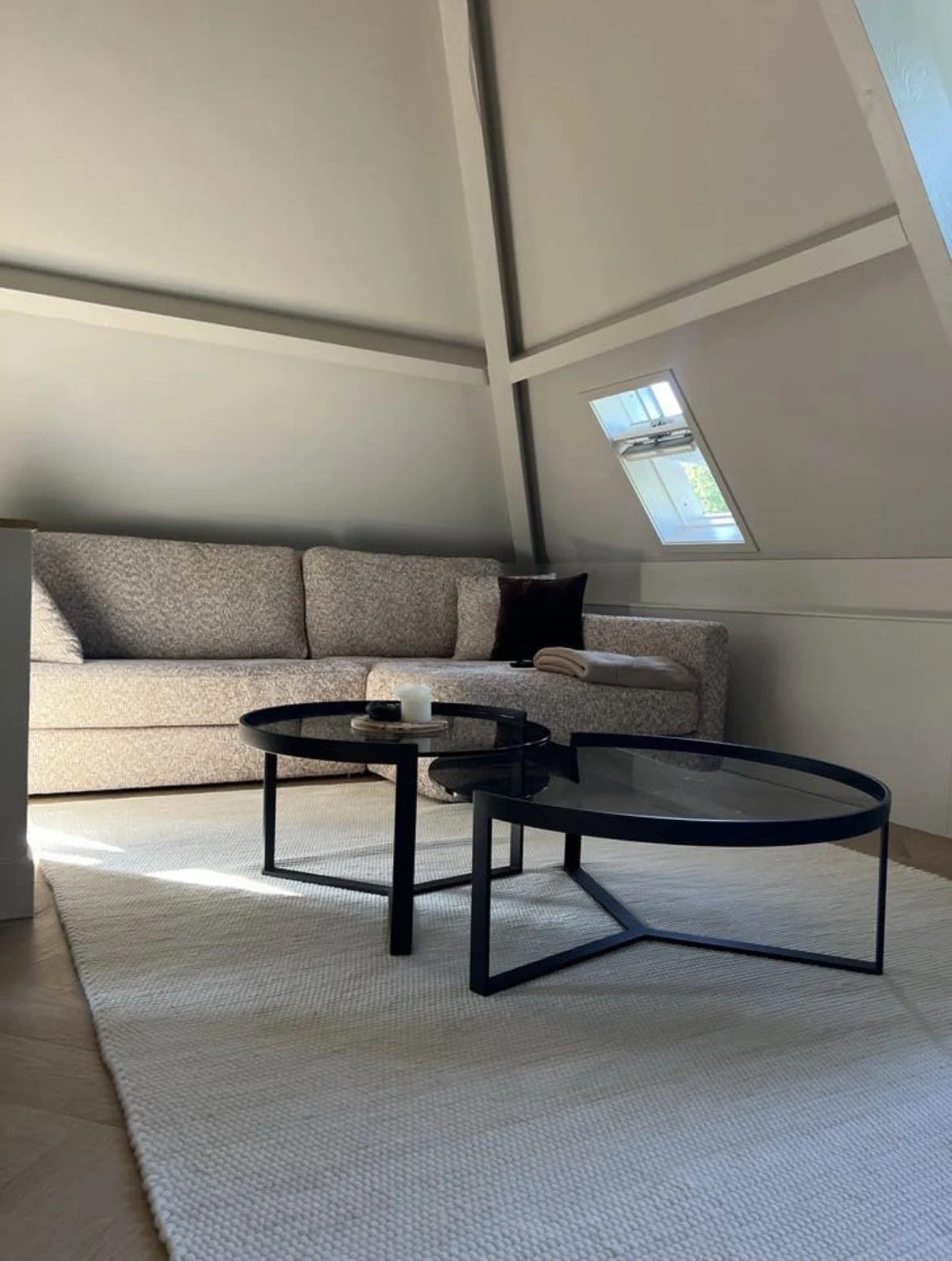 Couch with two black round sidetables