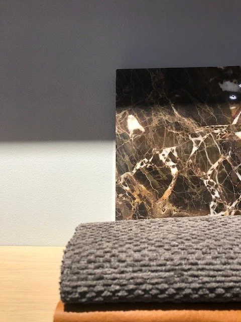 FLOT - Black and white marble cutting board with grey towel in front