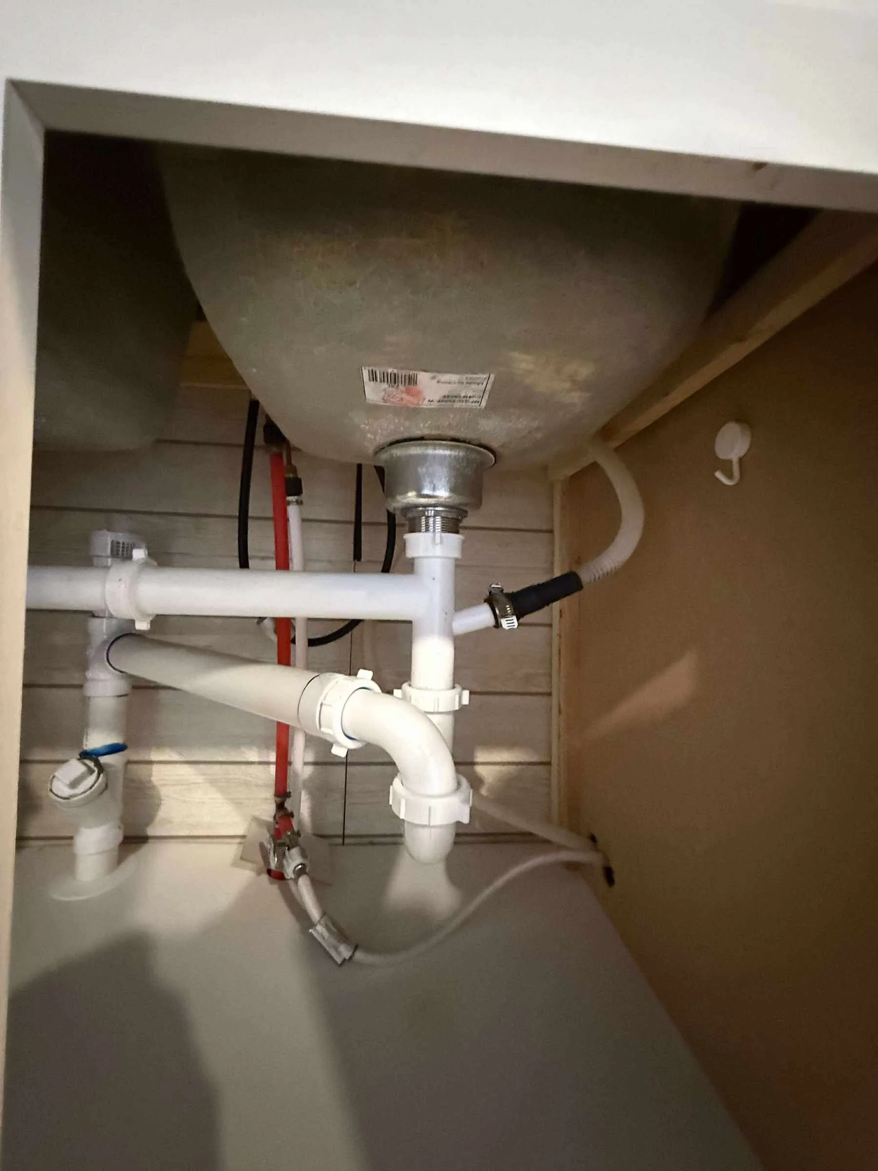 Leak under sink - replace tubular plastic p-trap and drainage.