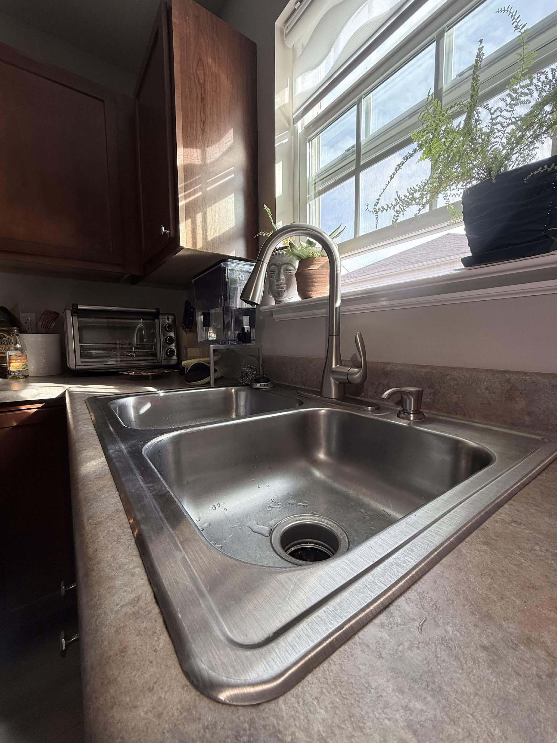 Side view of kitchen faucet replacement - Moen Brushed Stainless Pull Down Spray