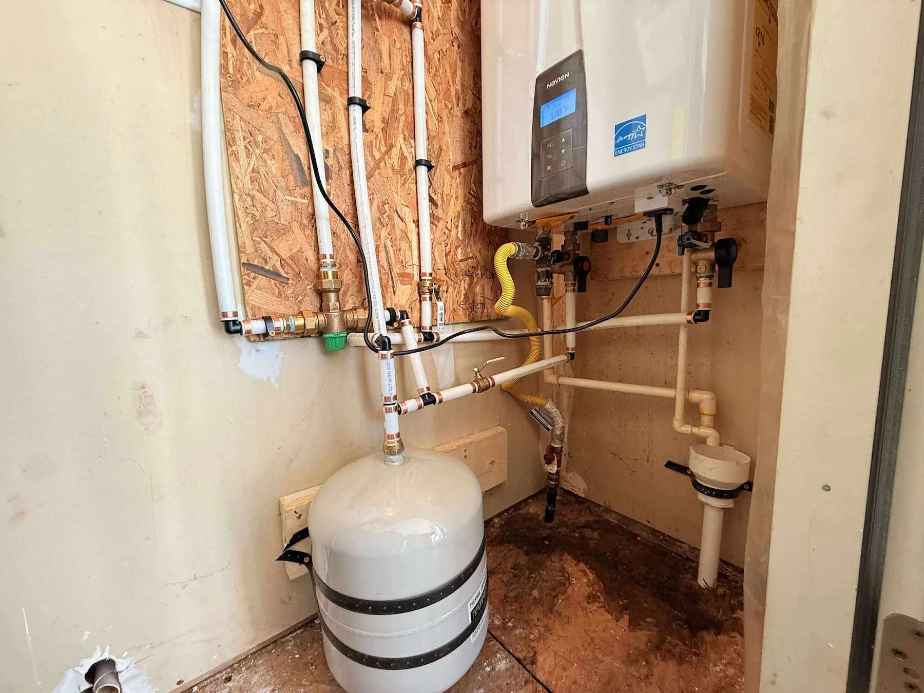 Tankless water heater solutions for HVAC loop systems