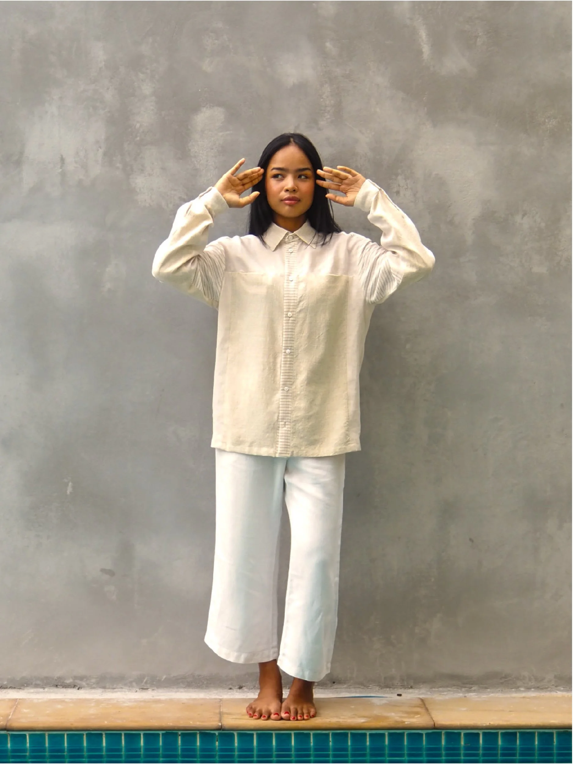 female model wearing beige adventure shirt