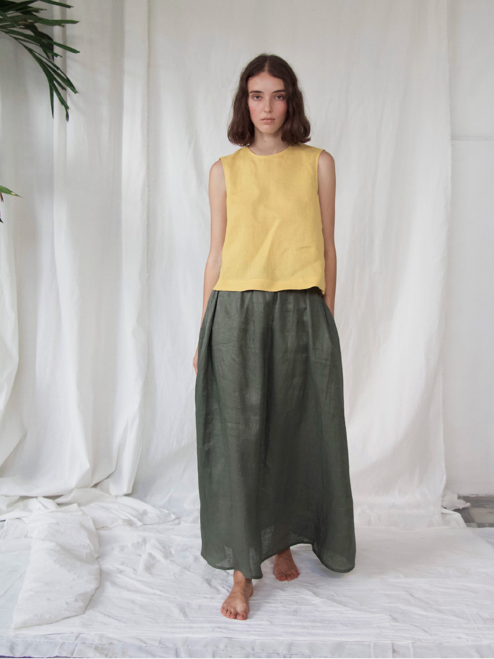 Lazy Skirt - model wearing green skirt with yellow top