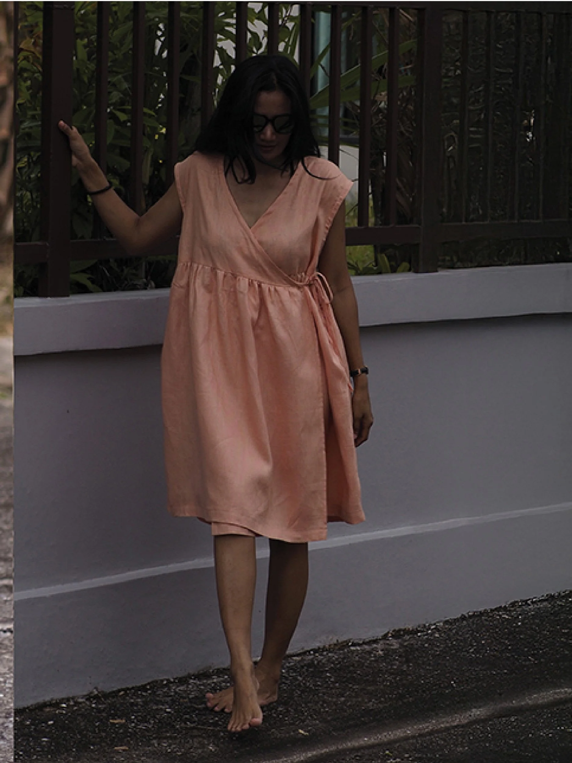 lazy wrap dress - model wearing pink version without sleeves