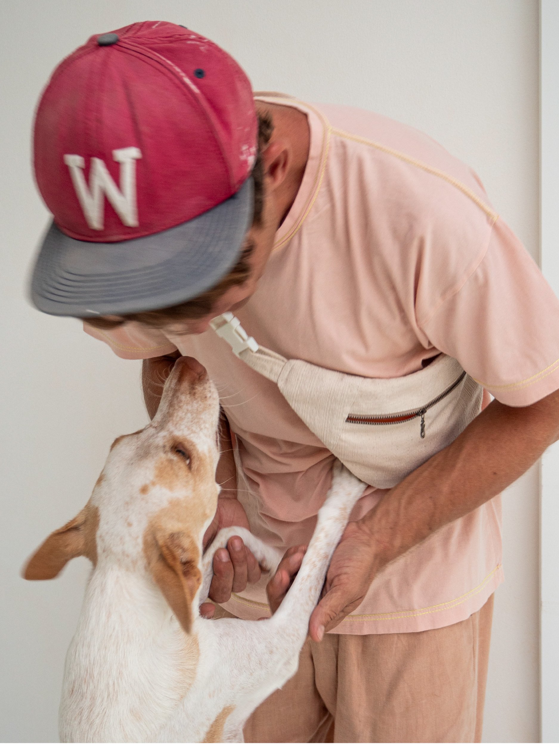 model wearing banana bag cross body with cute dog