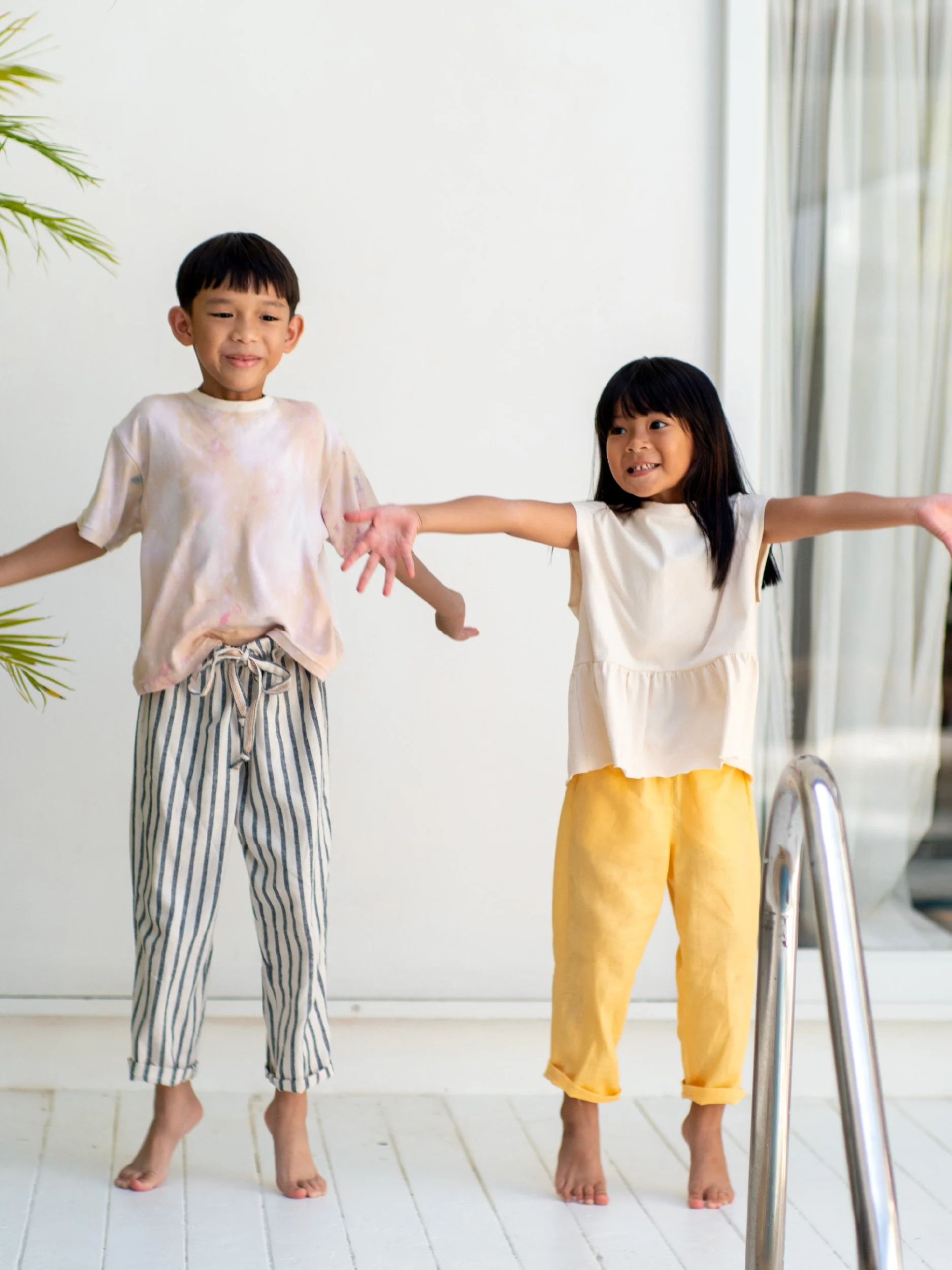 a brother and sister duo wearing lazy pants for kids
