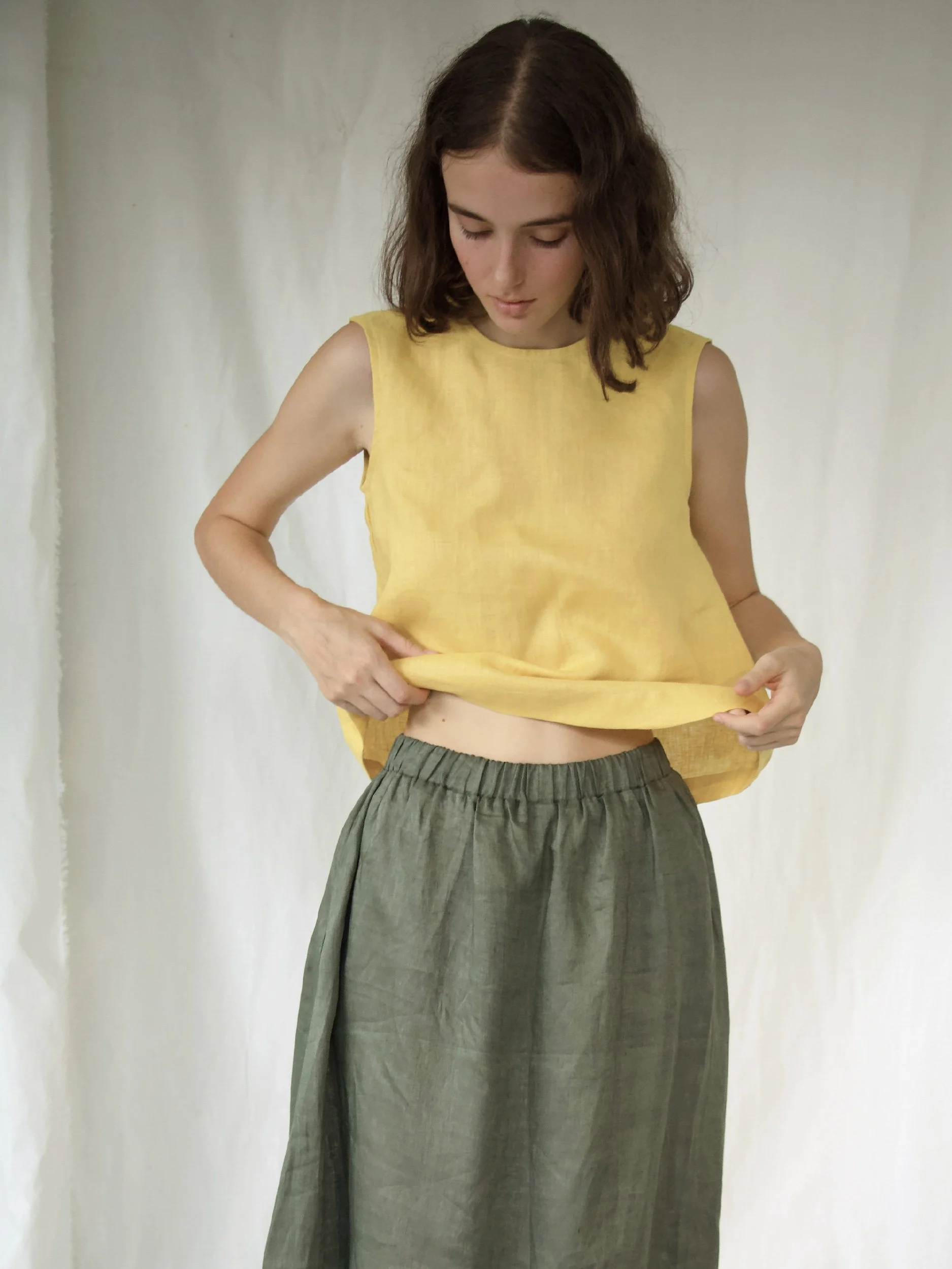 Lazy Skirt - model wearing green skirt with yellow top