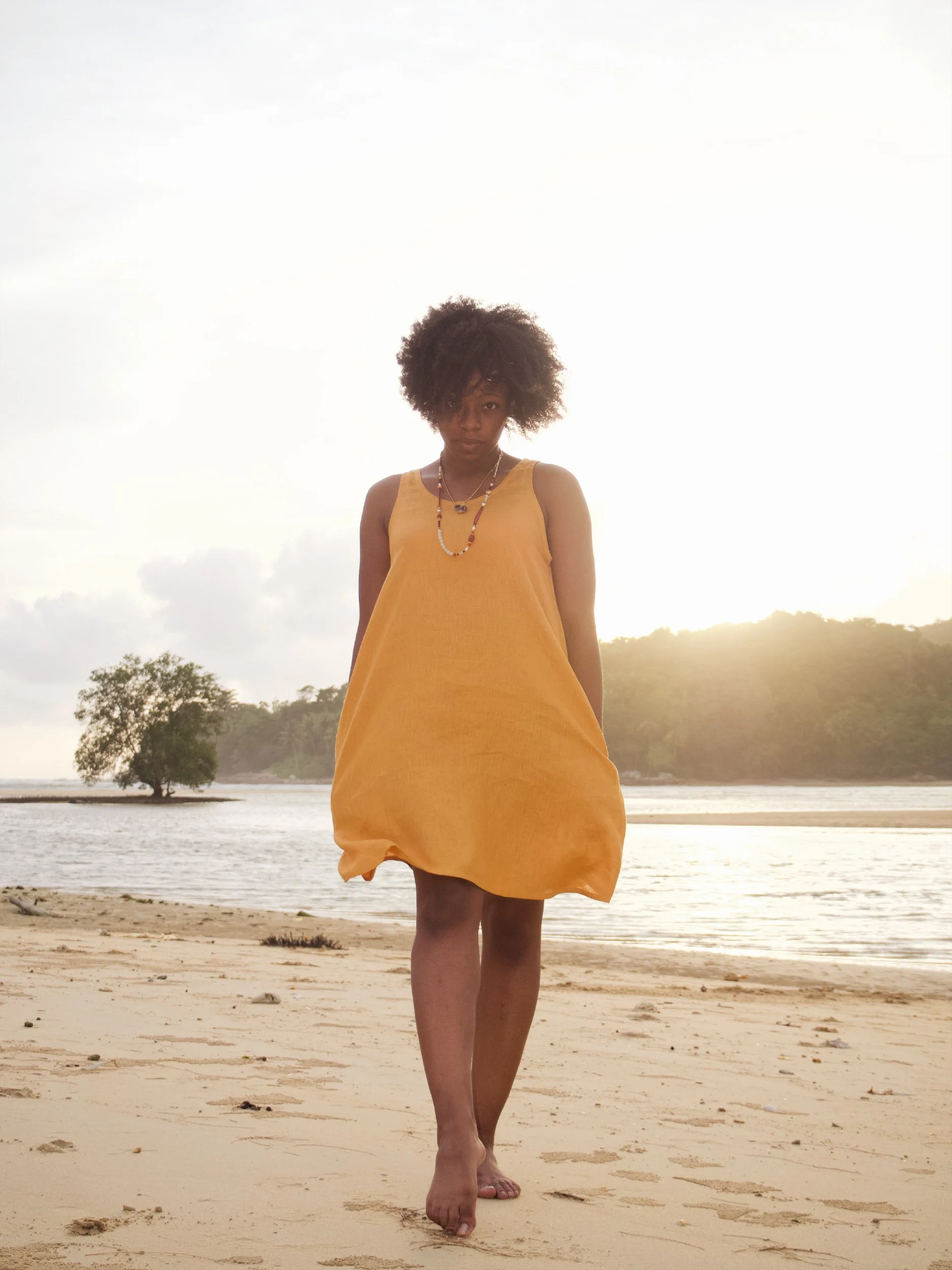 beach dress in orange on the beach - front view