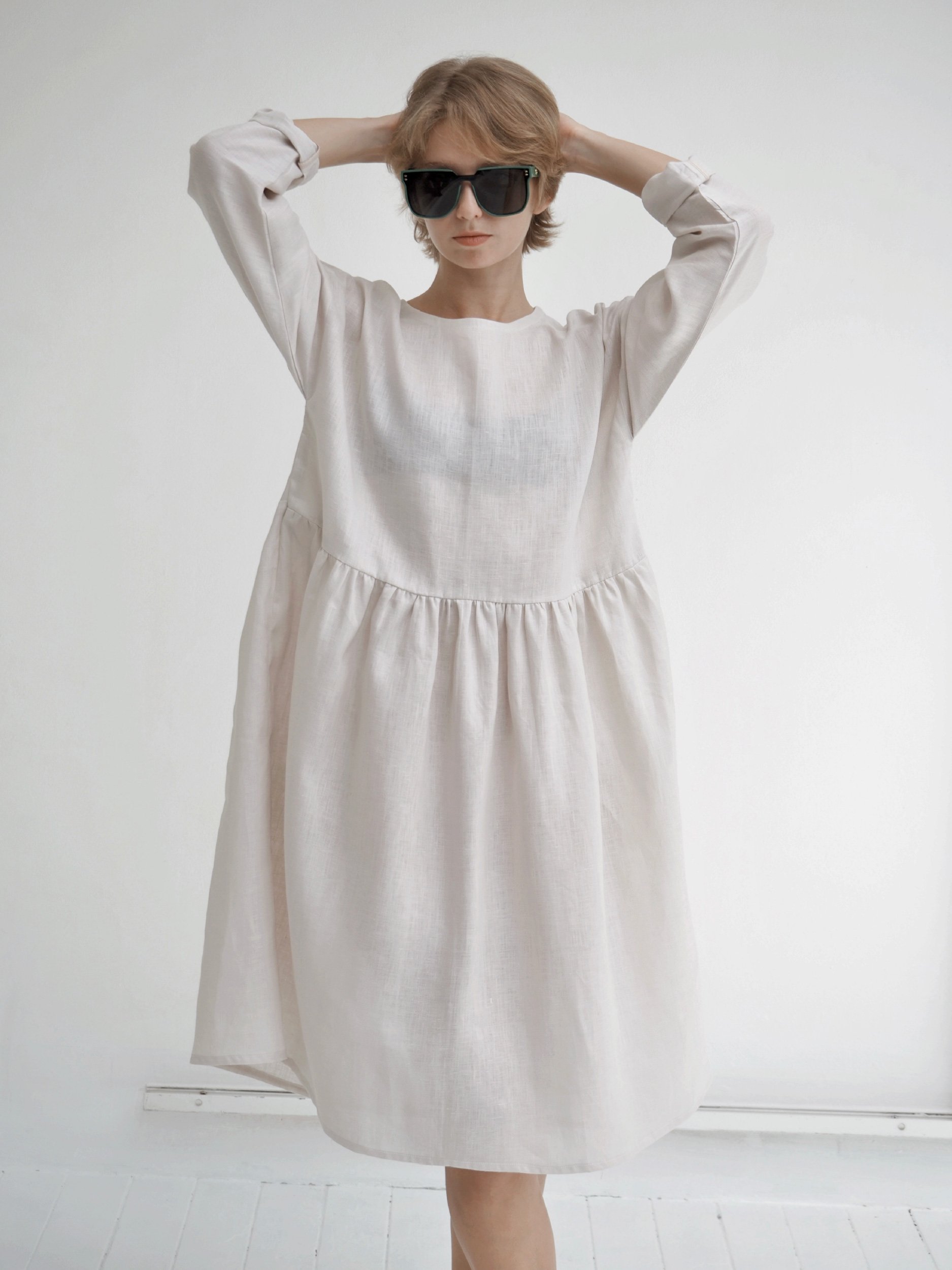 model wearing lazy top waist crop with long sleeves and long gathered extension