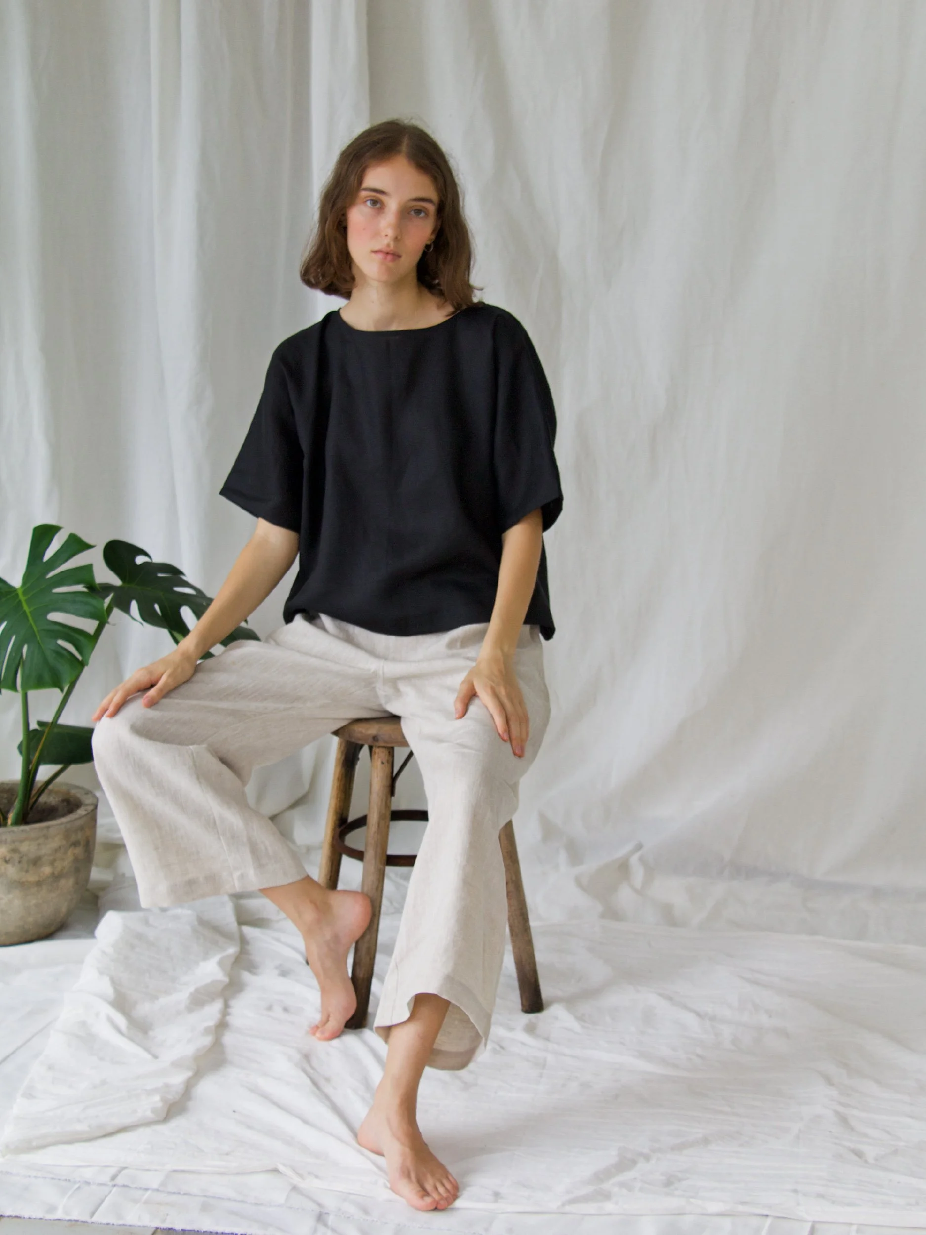 fancy pants model image sitting on a stool