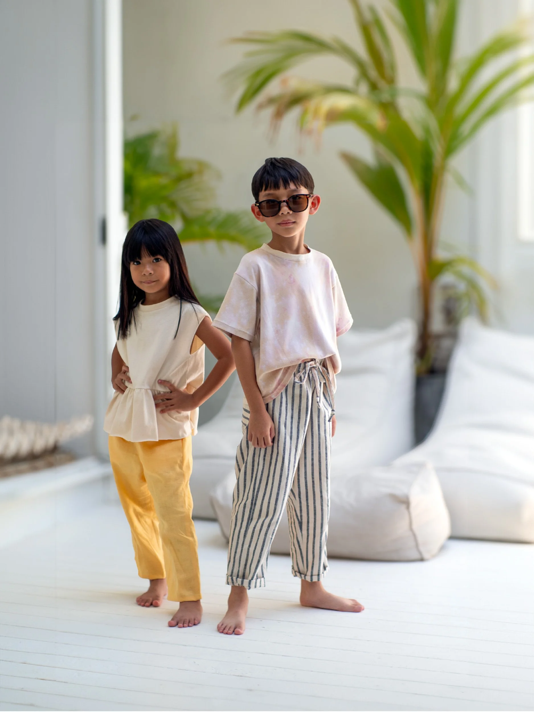 lazy pants for kids model image : girl with yellow linen lazy pants - boy with beige blue striped lazy pants