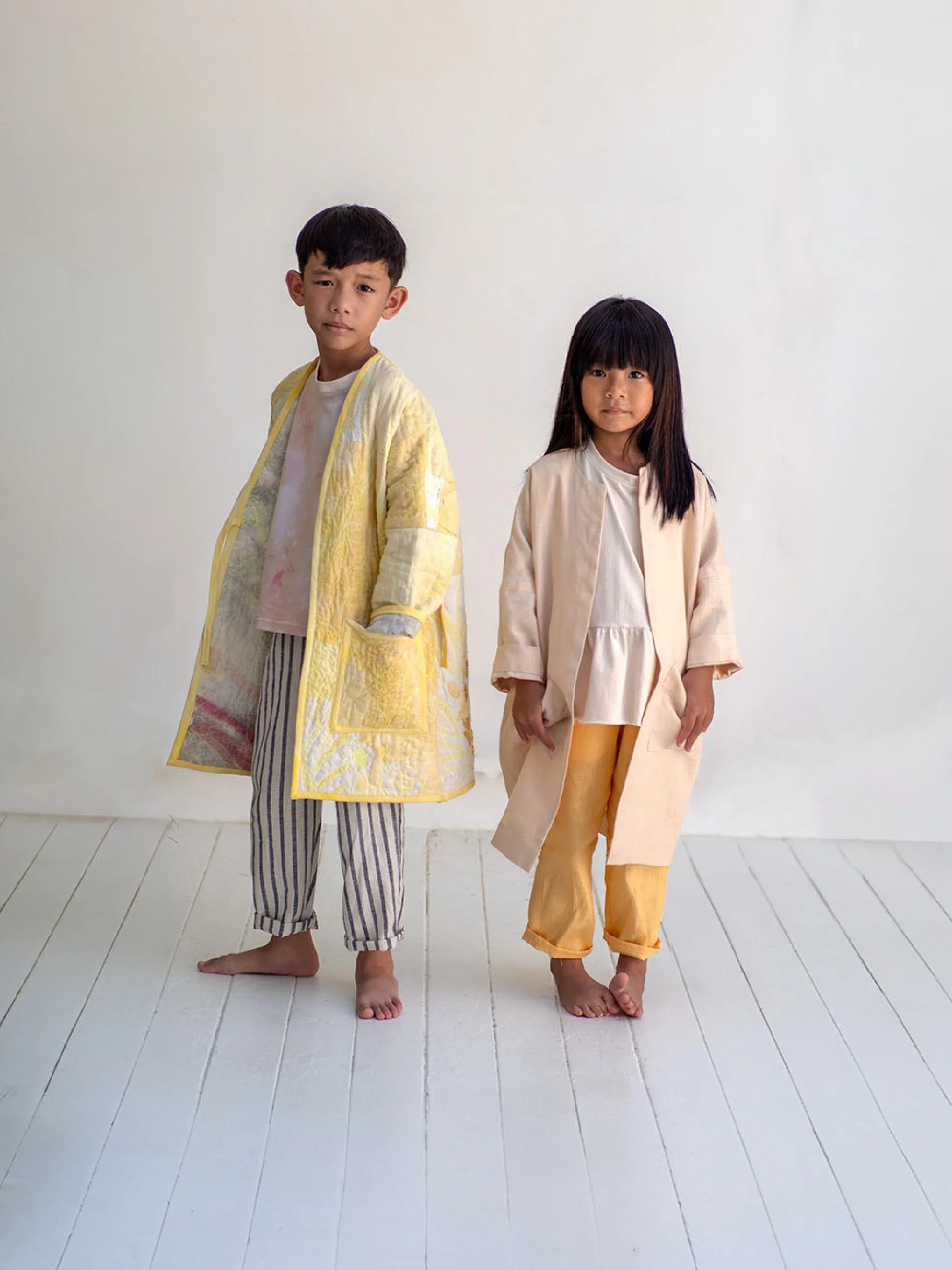 cozy coat for kids image quilted version with v neck vs. regular finish with crew neck and facing