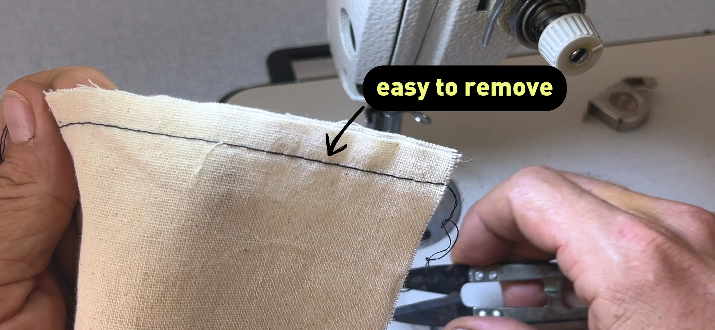 close up of big basting stitches with the label "easy to remove"