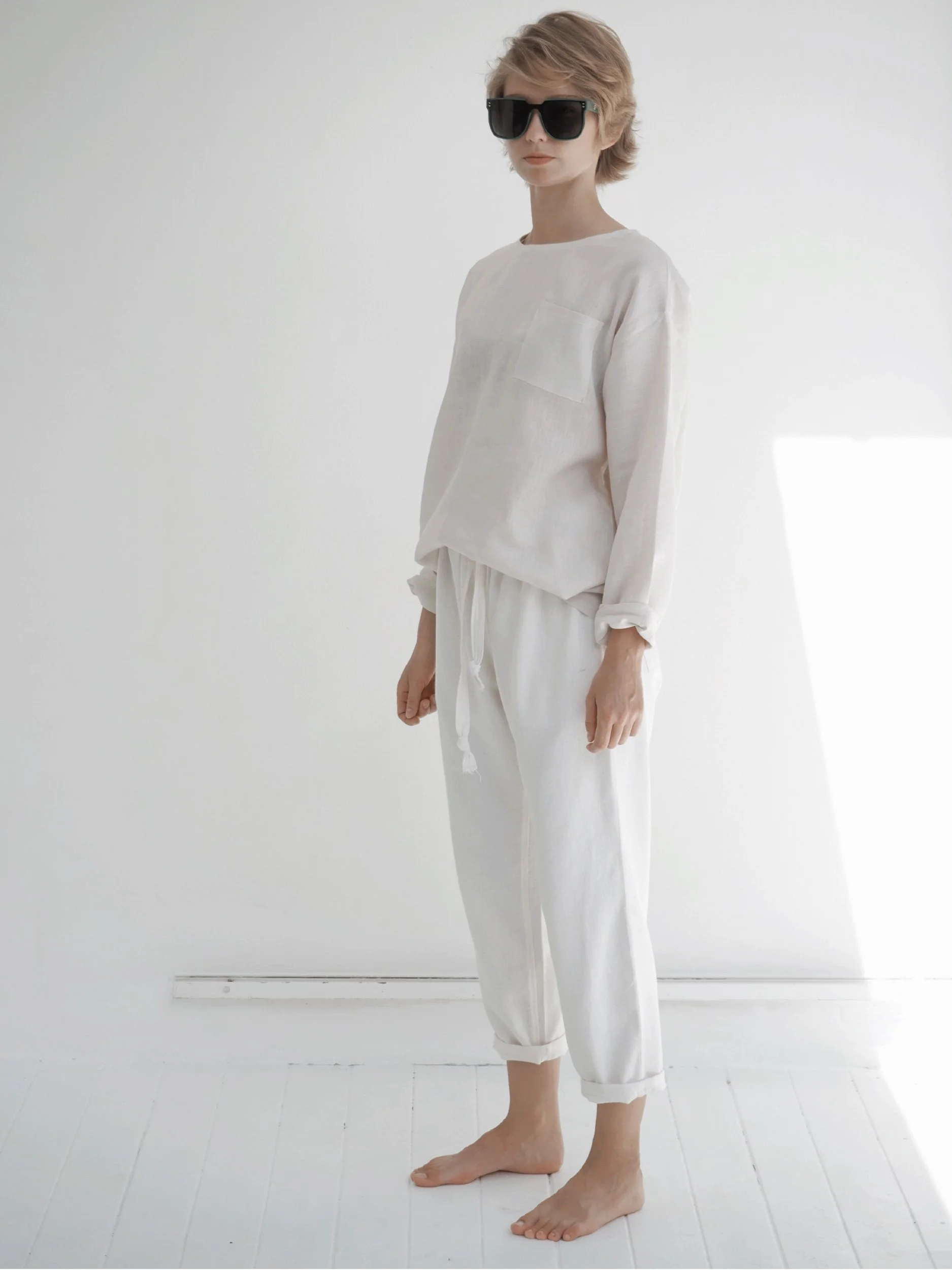 model wearing a full length lazy top with long sleeves