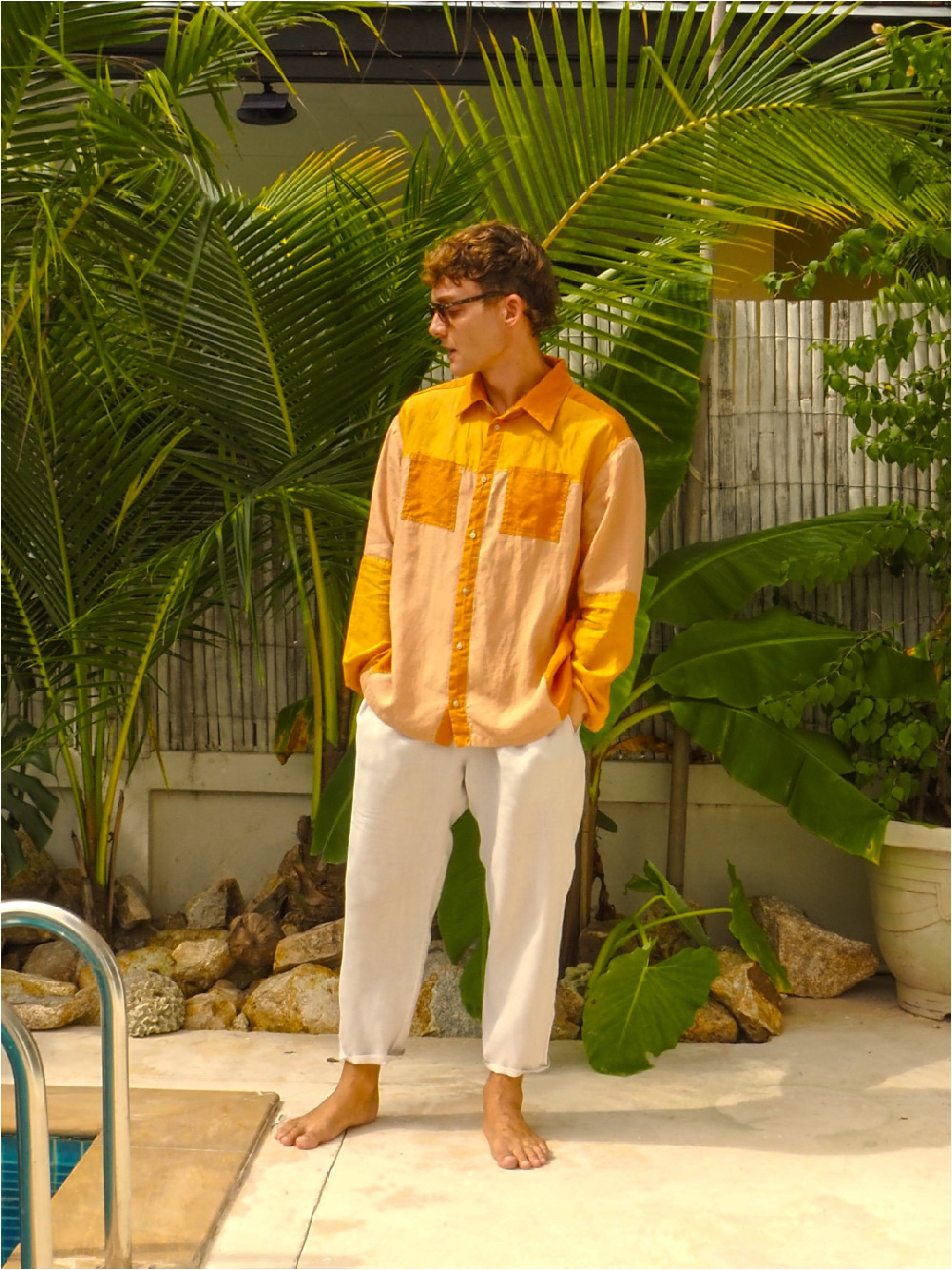 model wearing orange patch pocket adventure shirt - front view