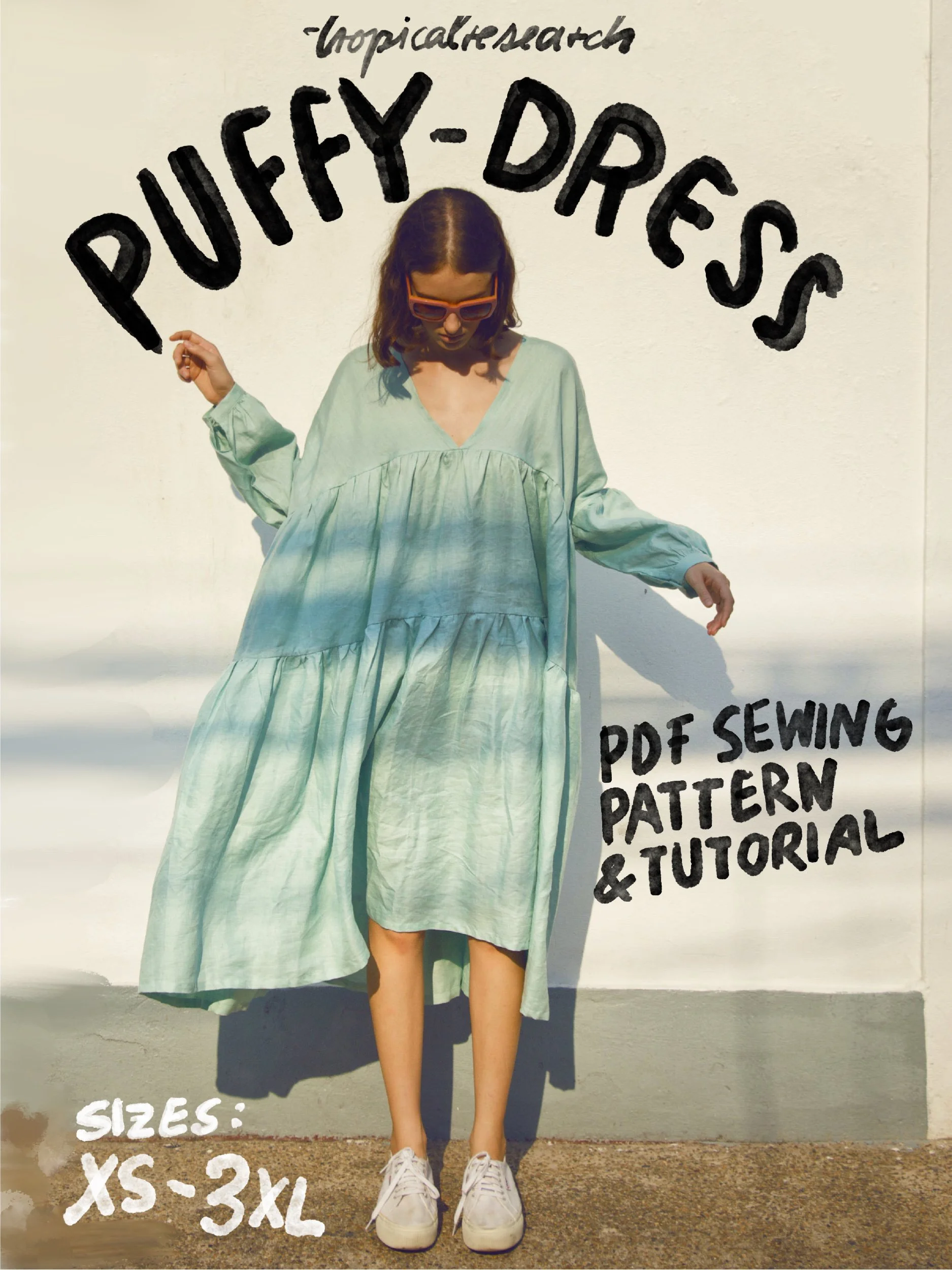 puffy dress cover image - model wearing mint green linen dress with deep v neck collar and gathered tiers and sleeves