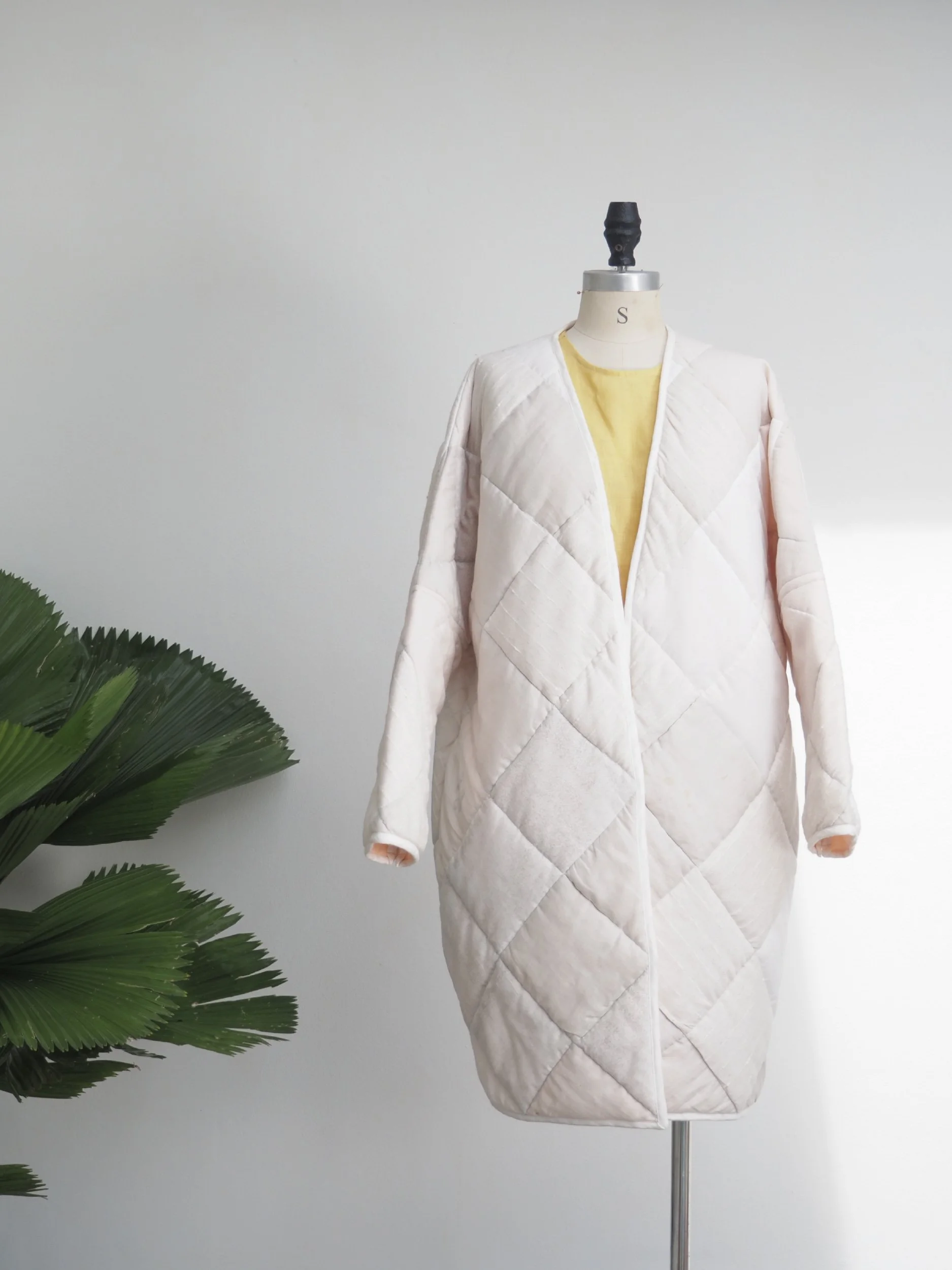 quilted cozy coat on dress form