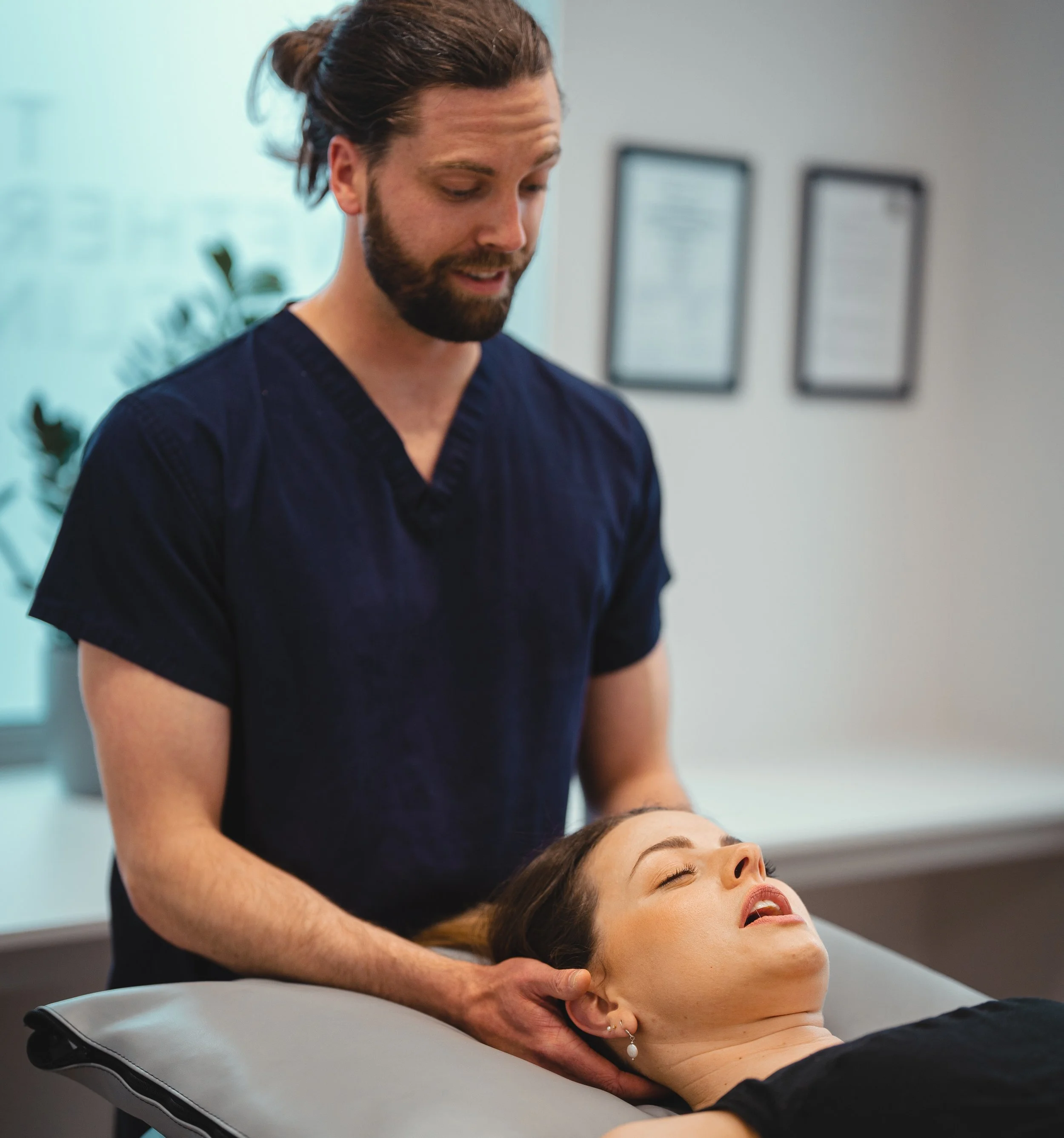 “Osteopath treating a patient for back pain at a clinic in Sheffield, UK”