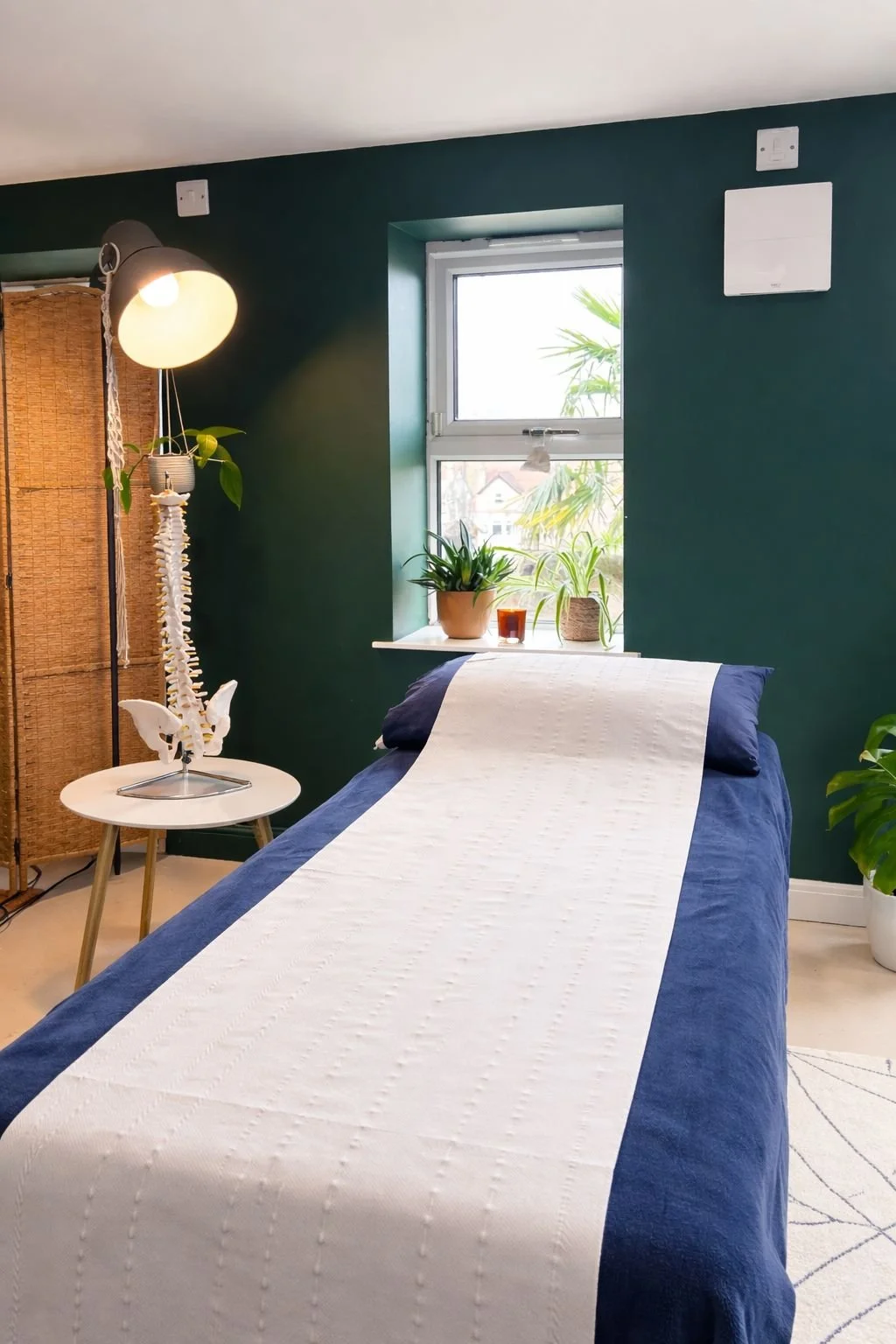 Professional osteopath treatment room with therapy table in Sheffield clinic
