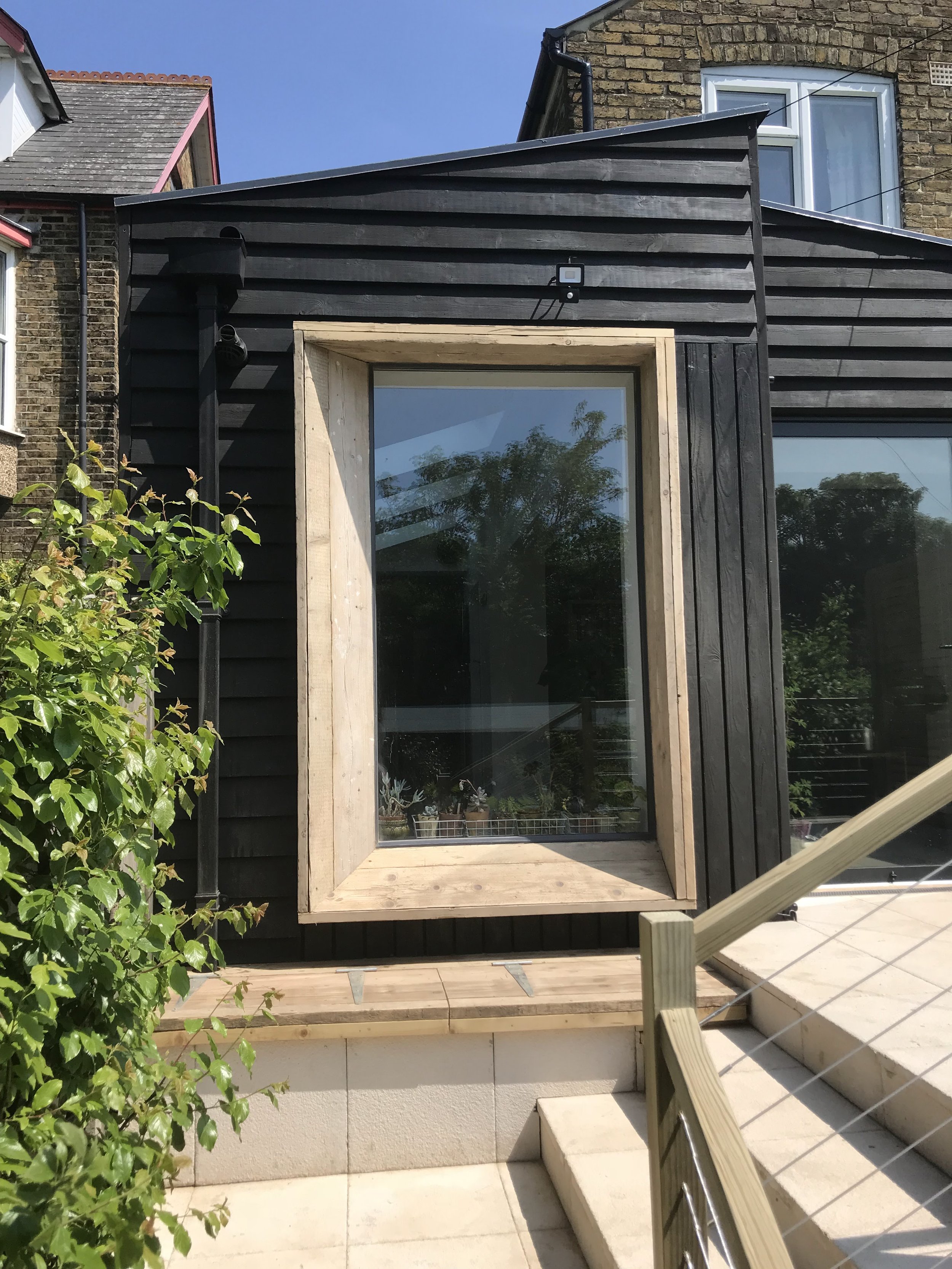 Extension, natural wood cladding
