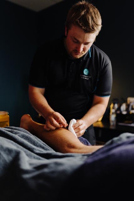 A therapist performing Dry Needling treatment on a patient in the Enhance studio.