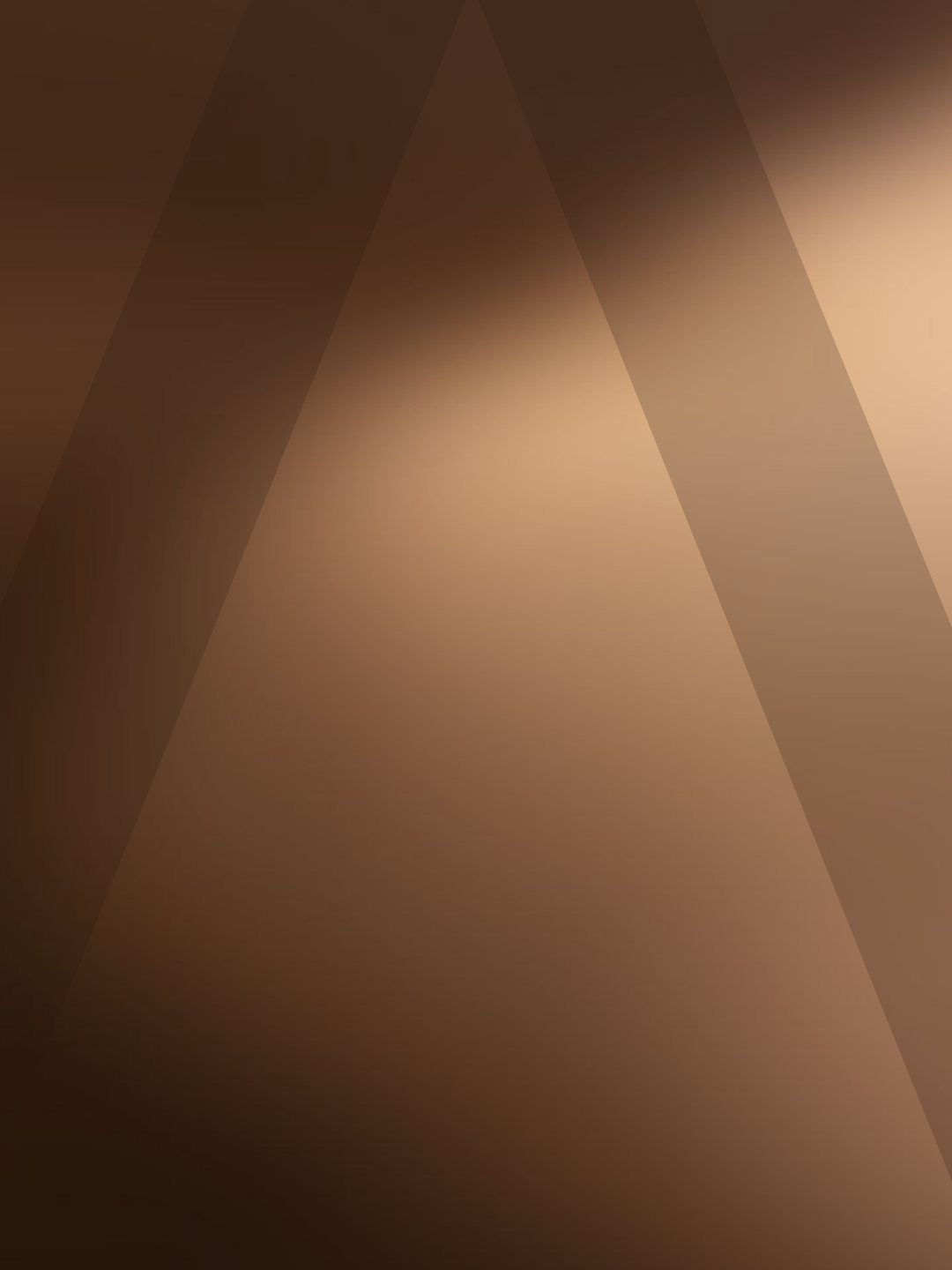 Blurred abstract background with brown and beige tones.
