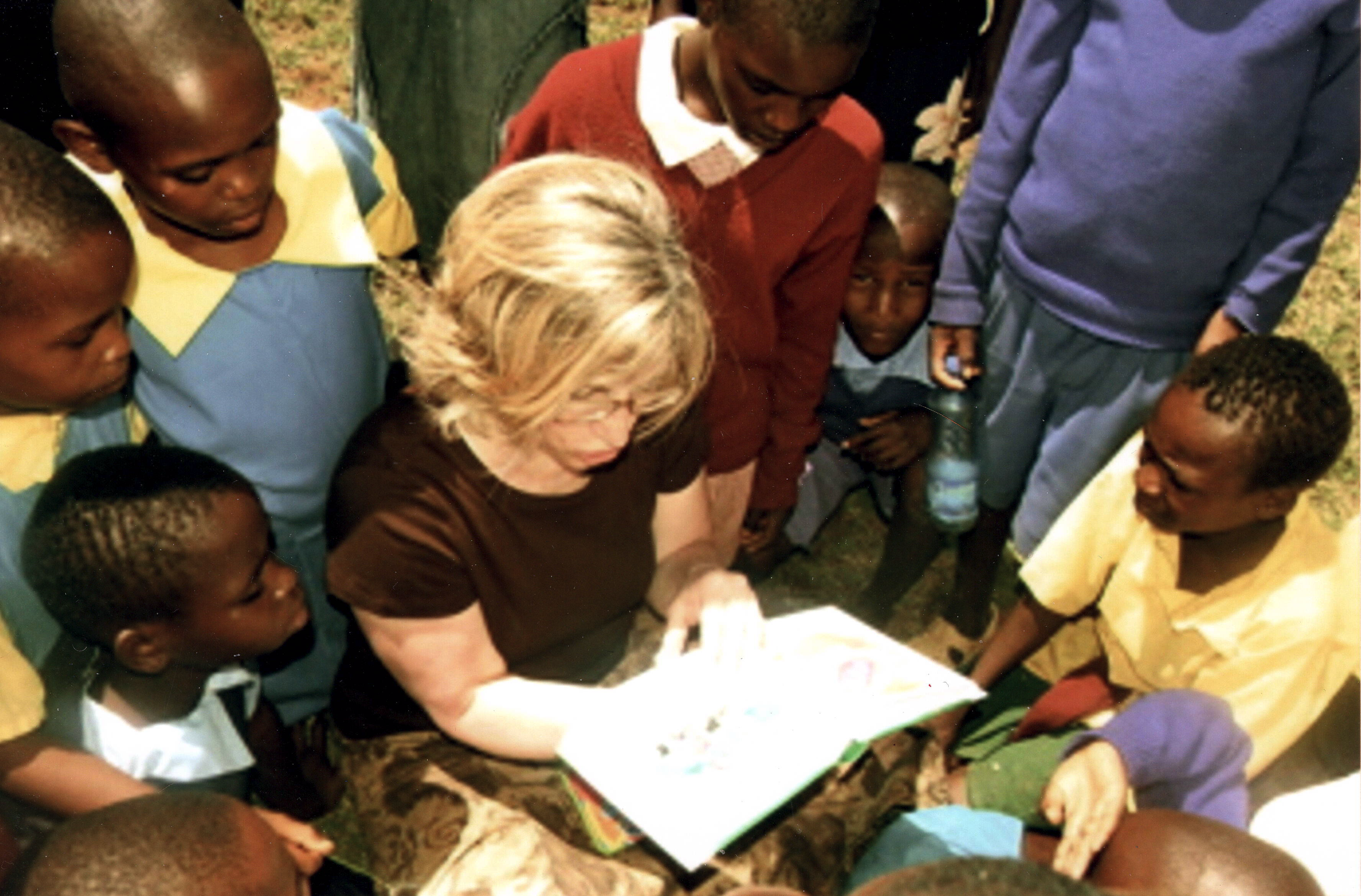 Joy Reading to Children in Kenya.png