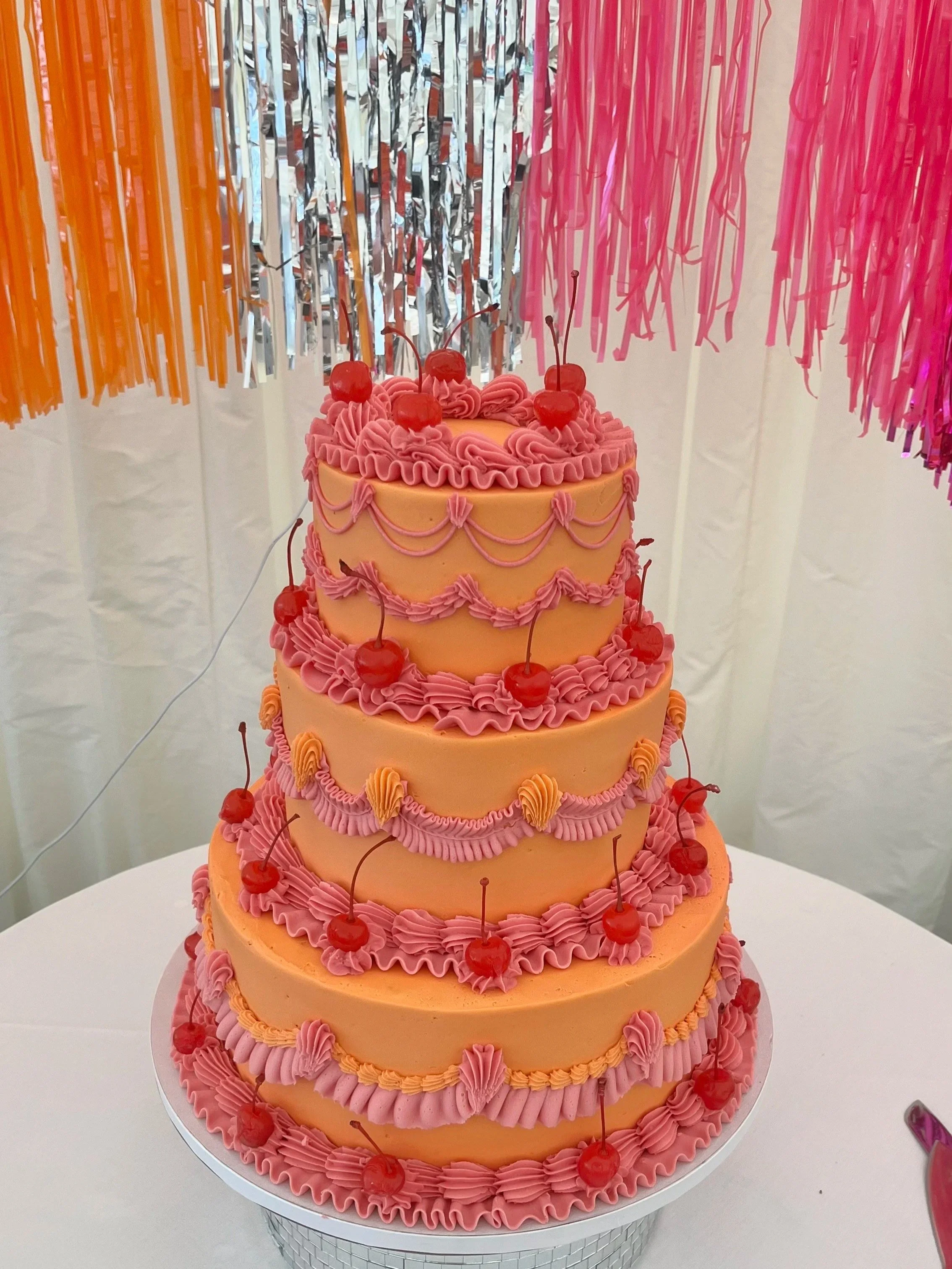 Three tier pink and orange alternative wedding cake 